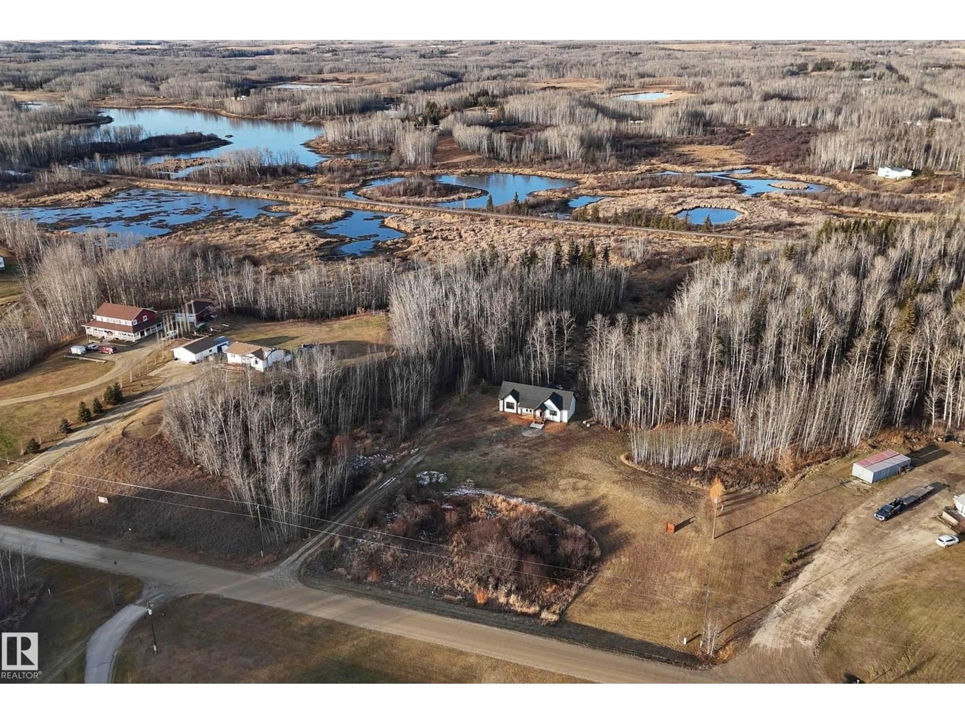 A pic from outside/outdoor area/front of a property/back of a property/a pic from drone, water/lake/river/ocean view for #6 - 54514 RGE ROAD 12, Rural Lac Ste. Anne County Alberta T0E1V2