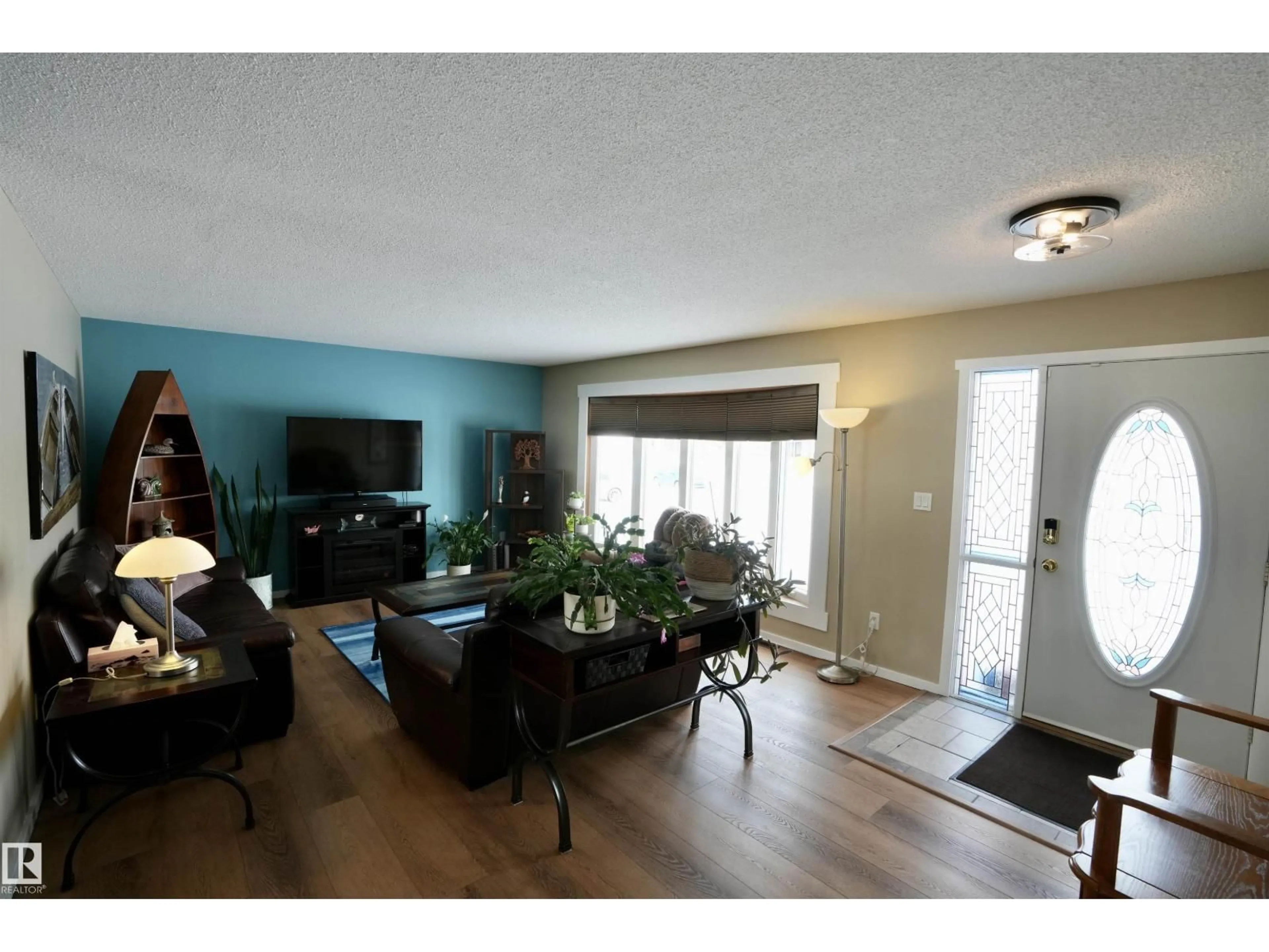 Living room with furniture, wood/laminate floor for 5206 55A ST, St. Paul Town Alberta T0A3A1