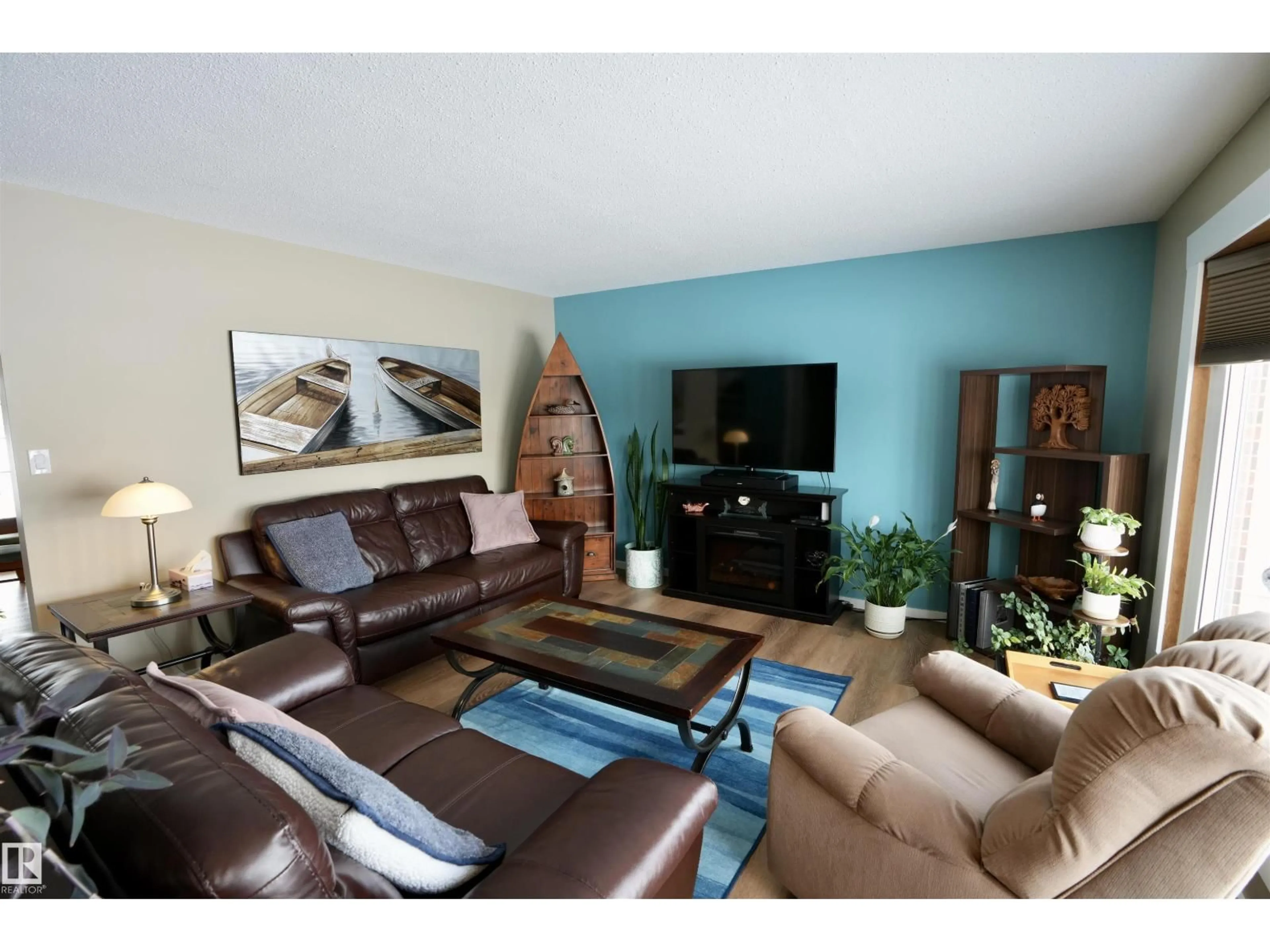 Living room with furniture, wood/laminate floor for 5206 55A ST, St. Paul Town Alberta T0A3A1