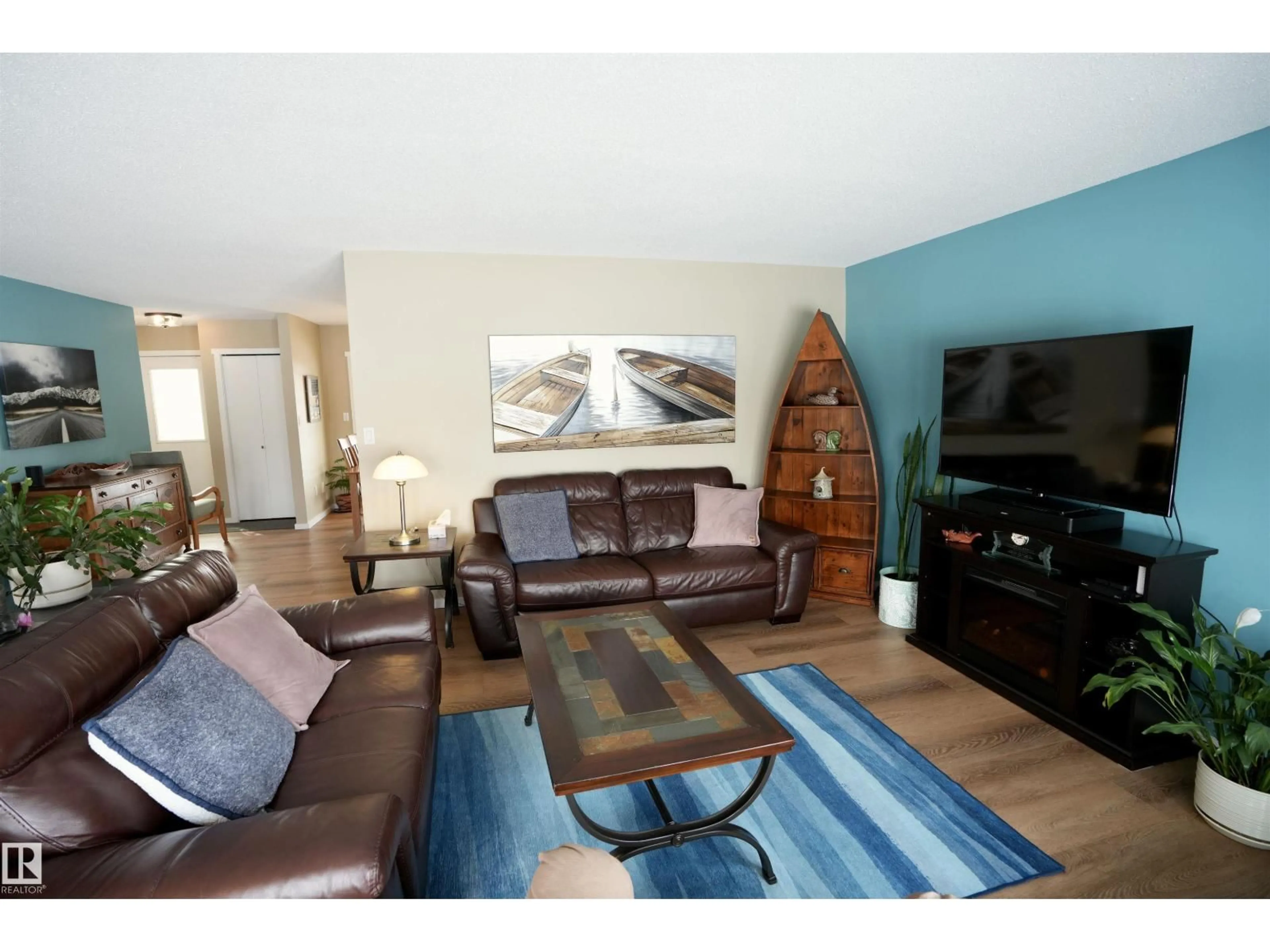 Living room with furniture, wood/laminate floor for 5206 55A ST, St. Paul Town Alberta T0A3A1