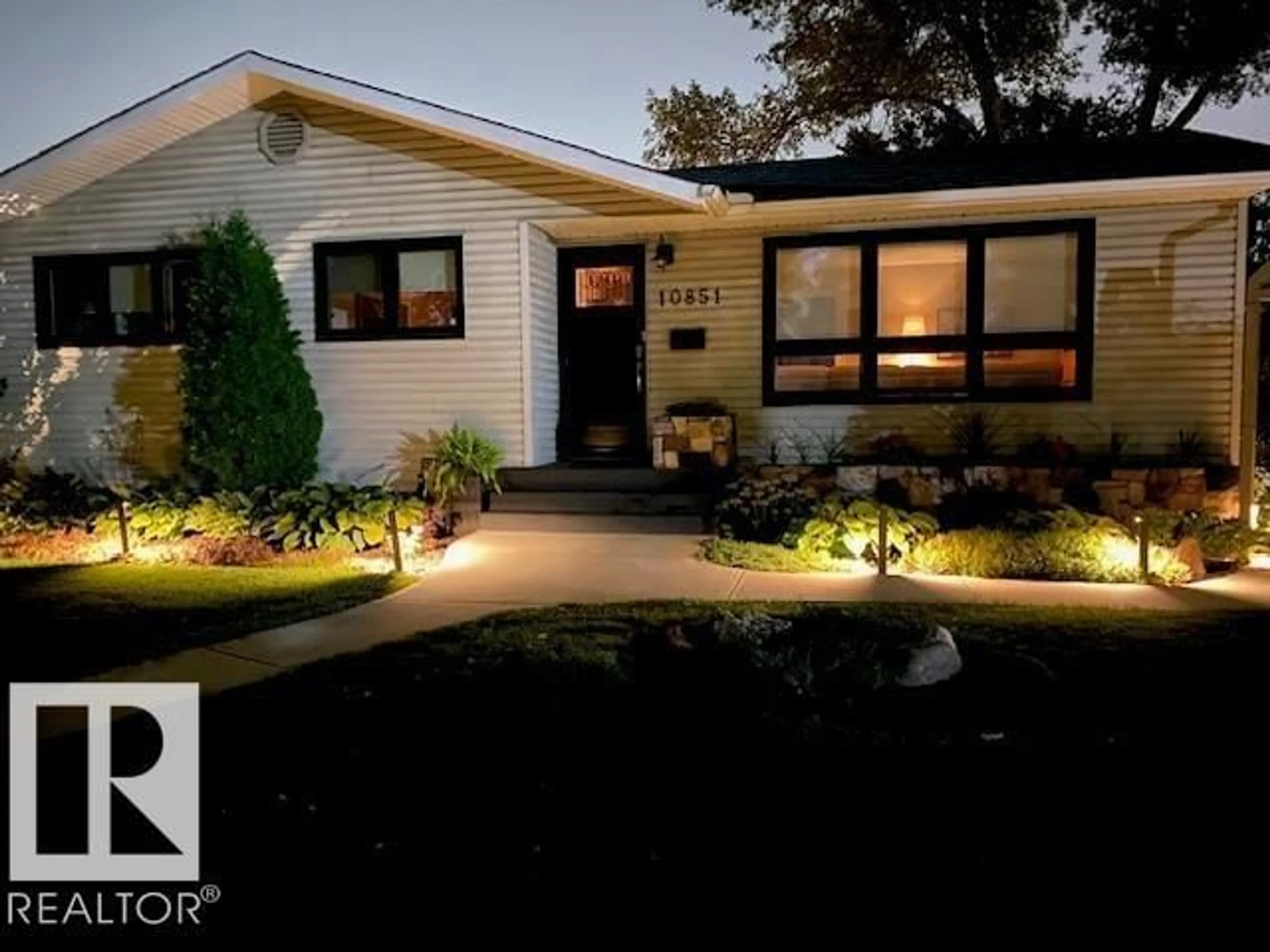 Home with vinyl exterior material, street for NW - 10851 141 ST, Edmonton Alberta T5M1T3