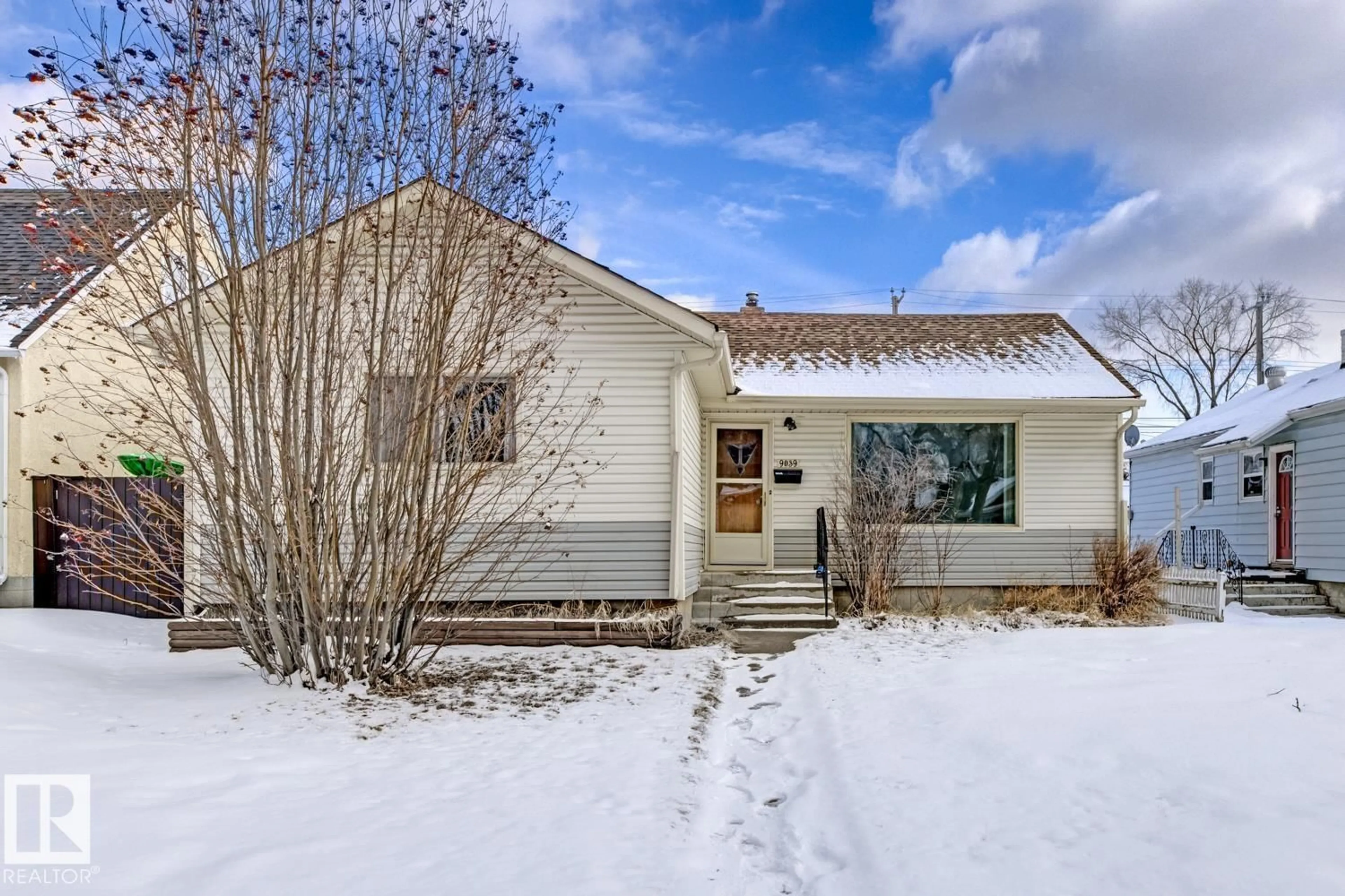 Home with vinyl exterior material, street for NW - 9039 90 ST, Edmonton Alberta T6C3L8