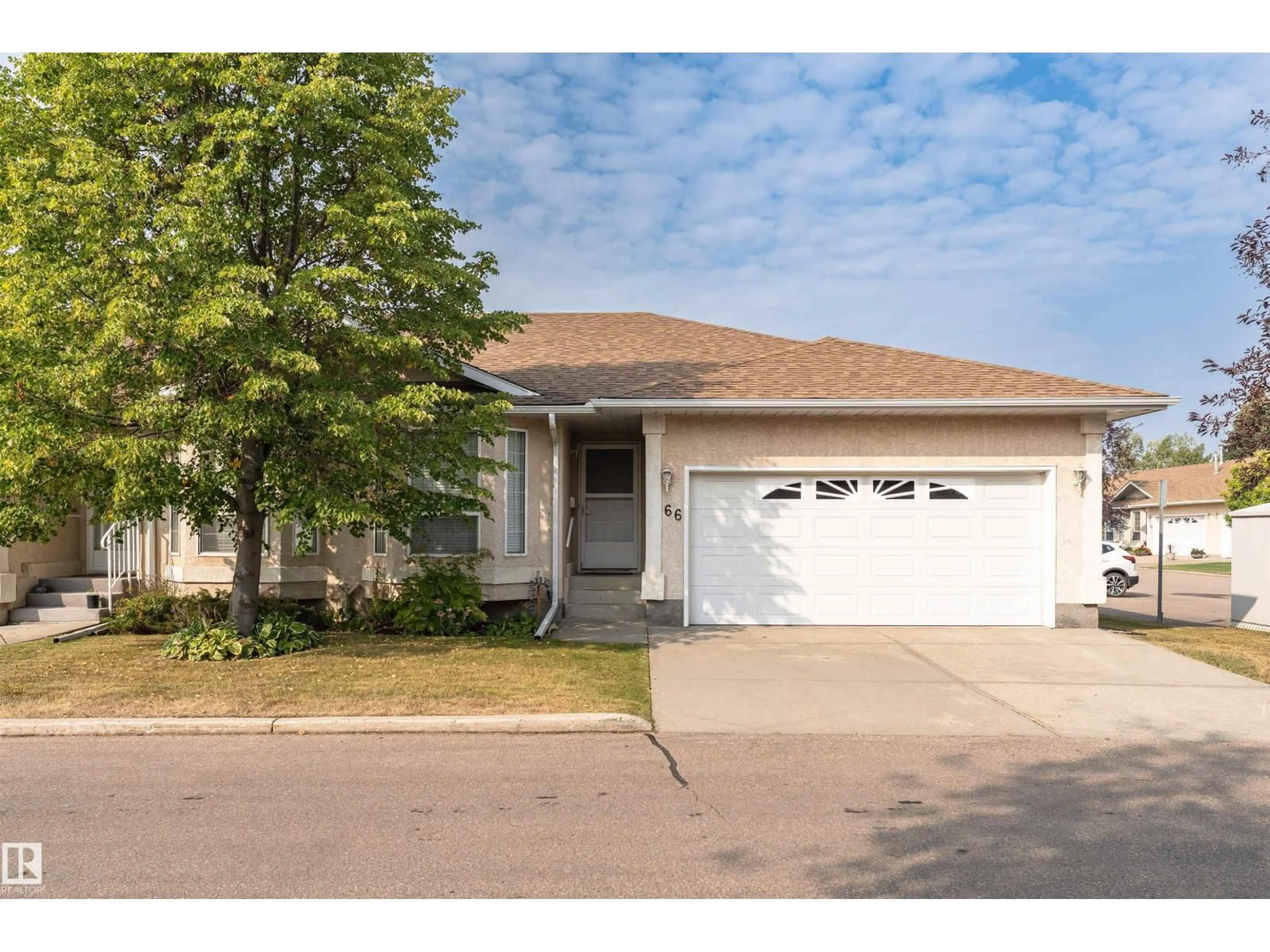 Home with vinyl exterior material, street for NW - 66 124 ST, Edmonton Alberta T5L5B7