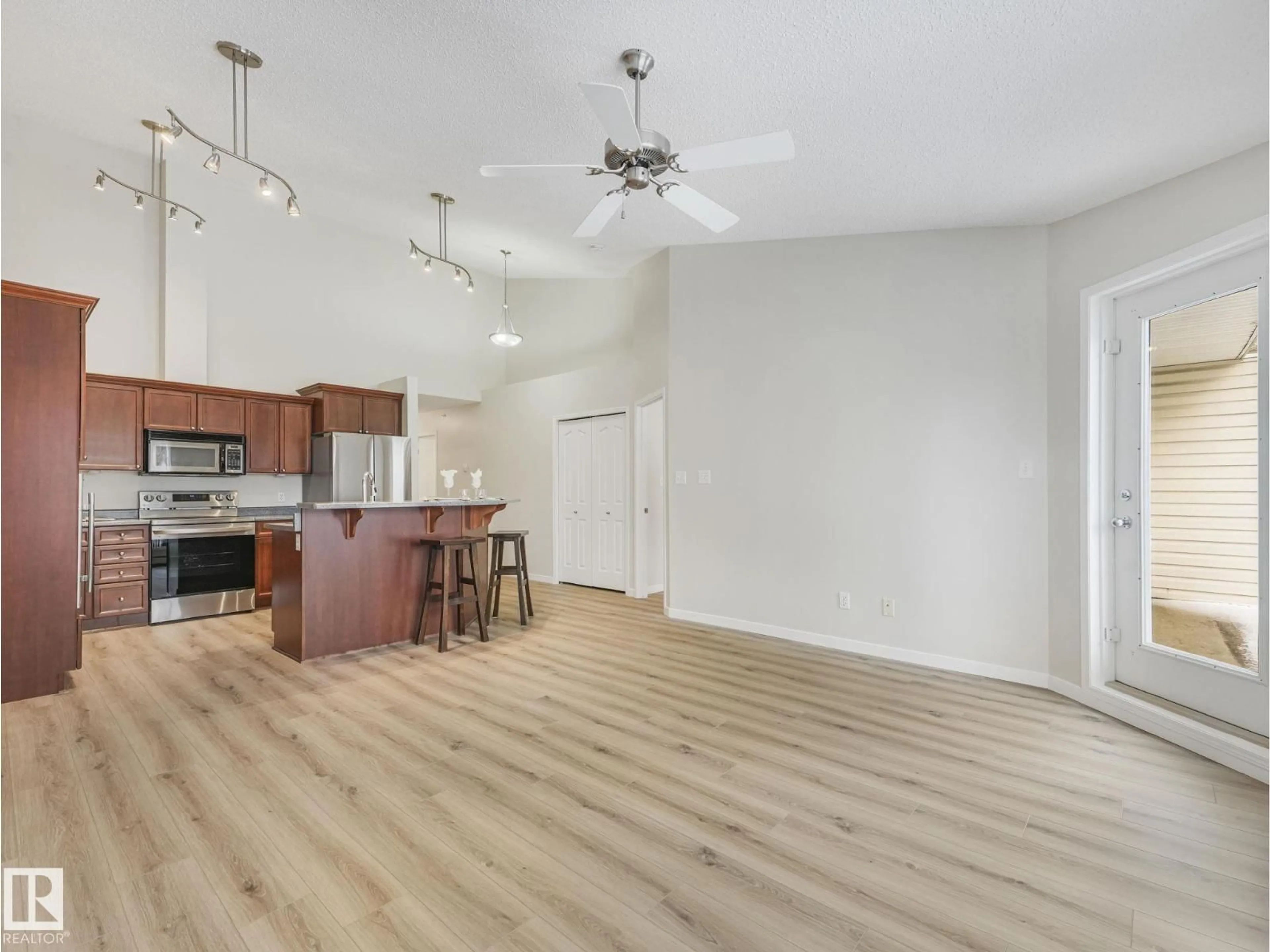 Open concept kitchen, wood/laminate floor for 515 10311 111 ST NW, Edmonton Alberta T5K2Y8