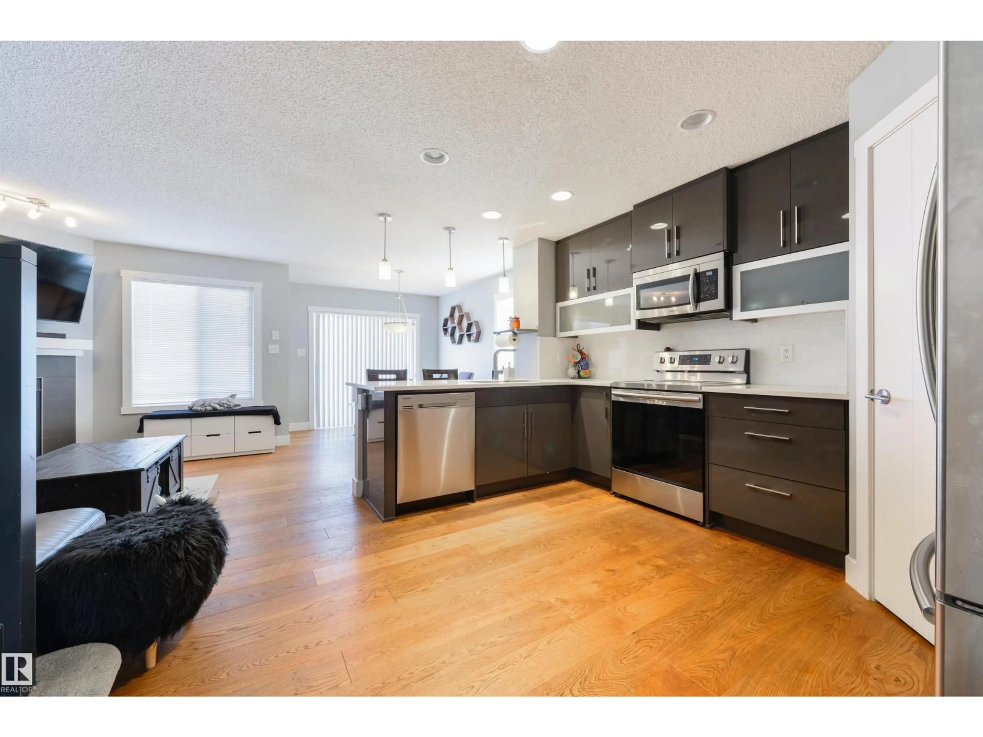 Open concept kitchen, wood/laminate floor for 60 VANDERBILT CM, Spruce Grove Alberta T7X0S9