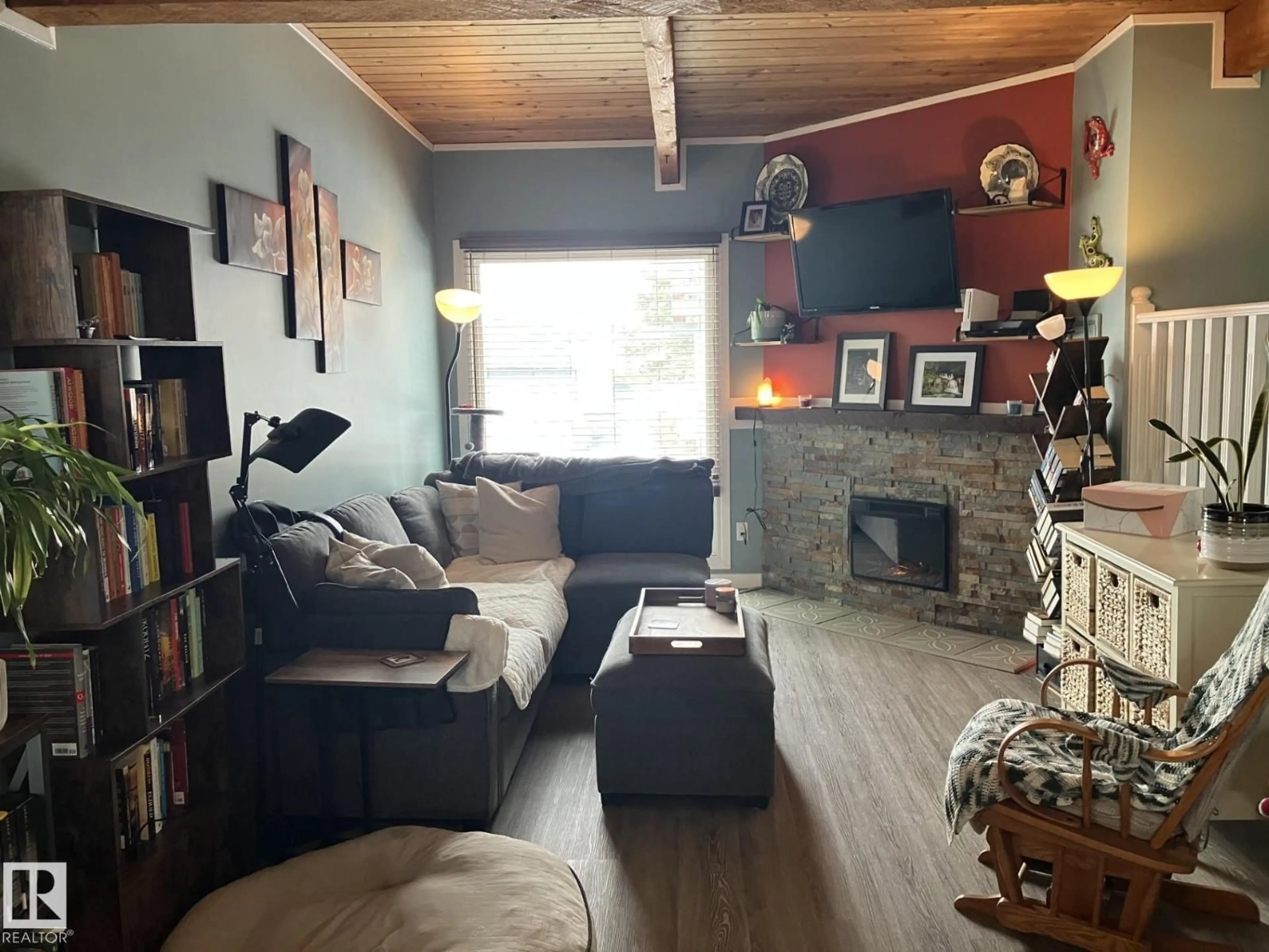 Living room with furniture, wood/laminate floor for 14622 118 STREET, Edmonton Alberta T5X2J4