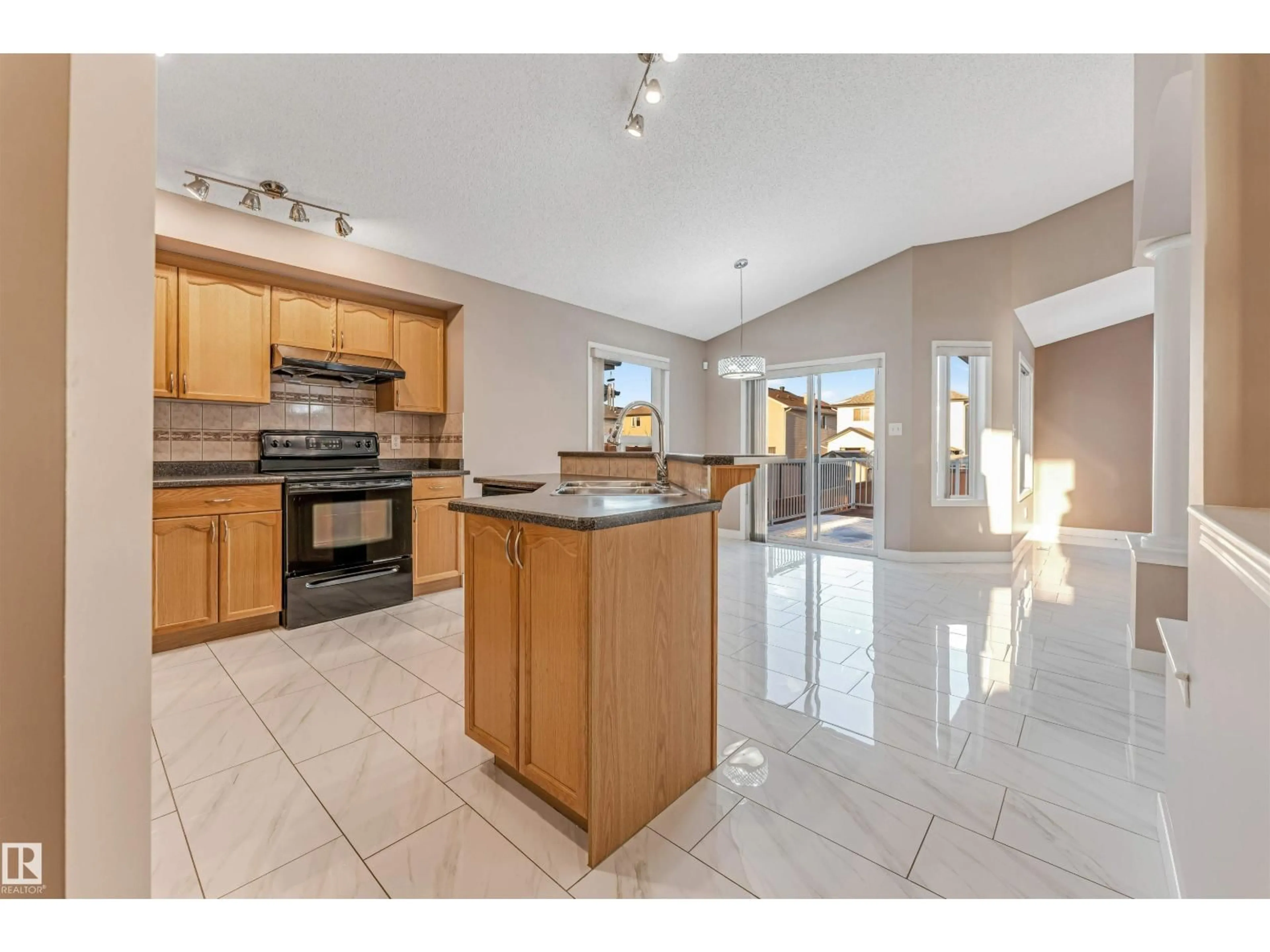 Open concept kitchen, ceramic/tile floor for 3331 26 ST, Edmonton Alberta T6T1Z4