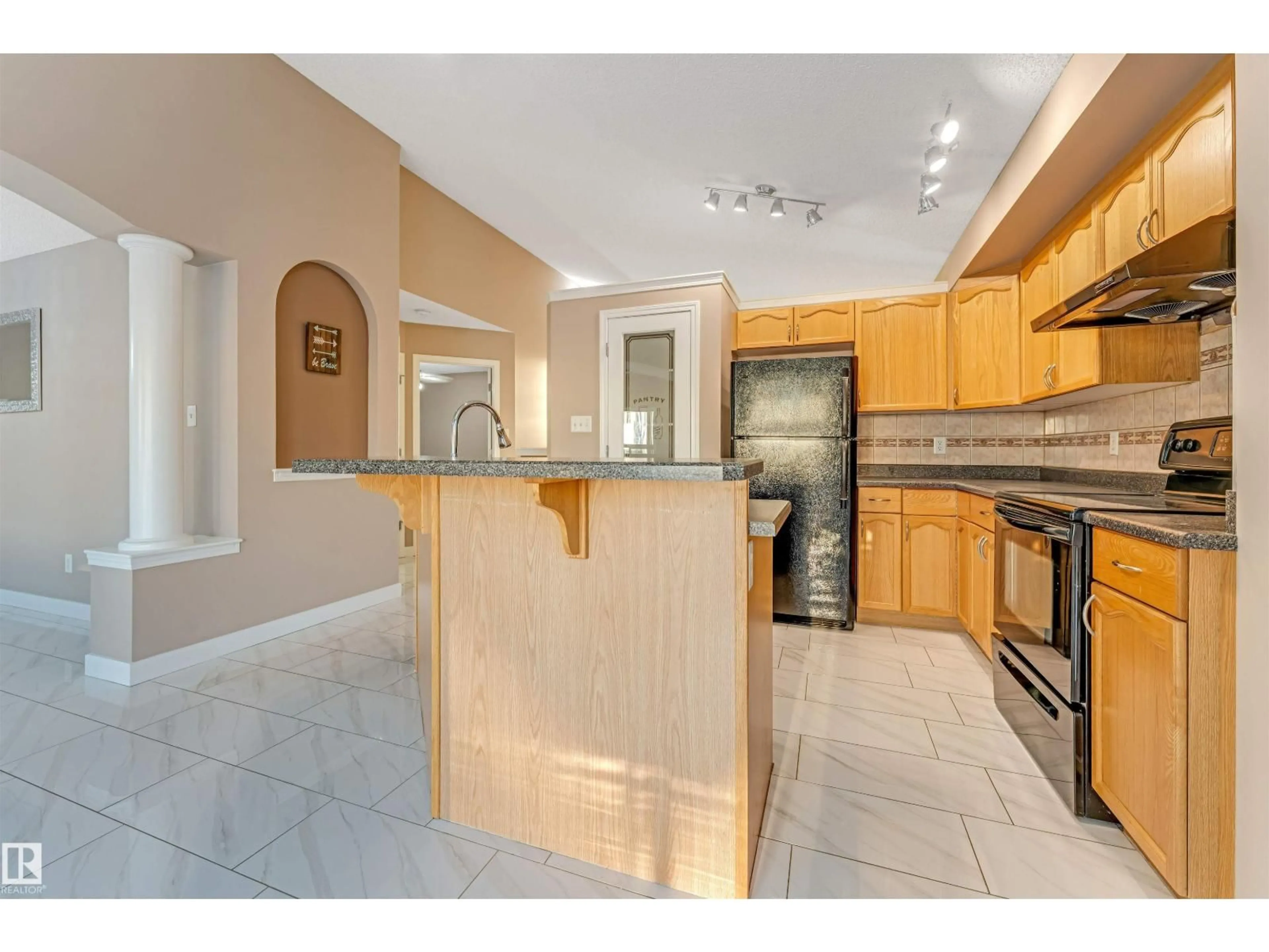 Open concept kitchen, ceramic/tile floor for 3331 26 ST, Edmonton Alberta T6T1Z4