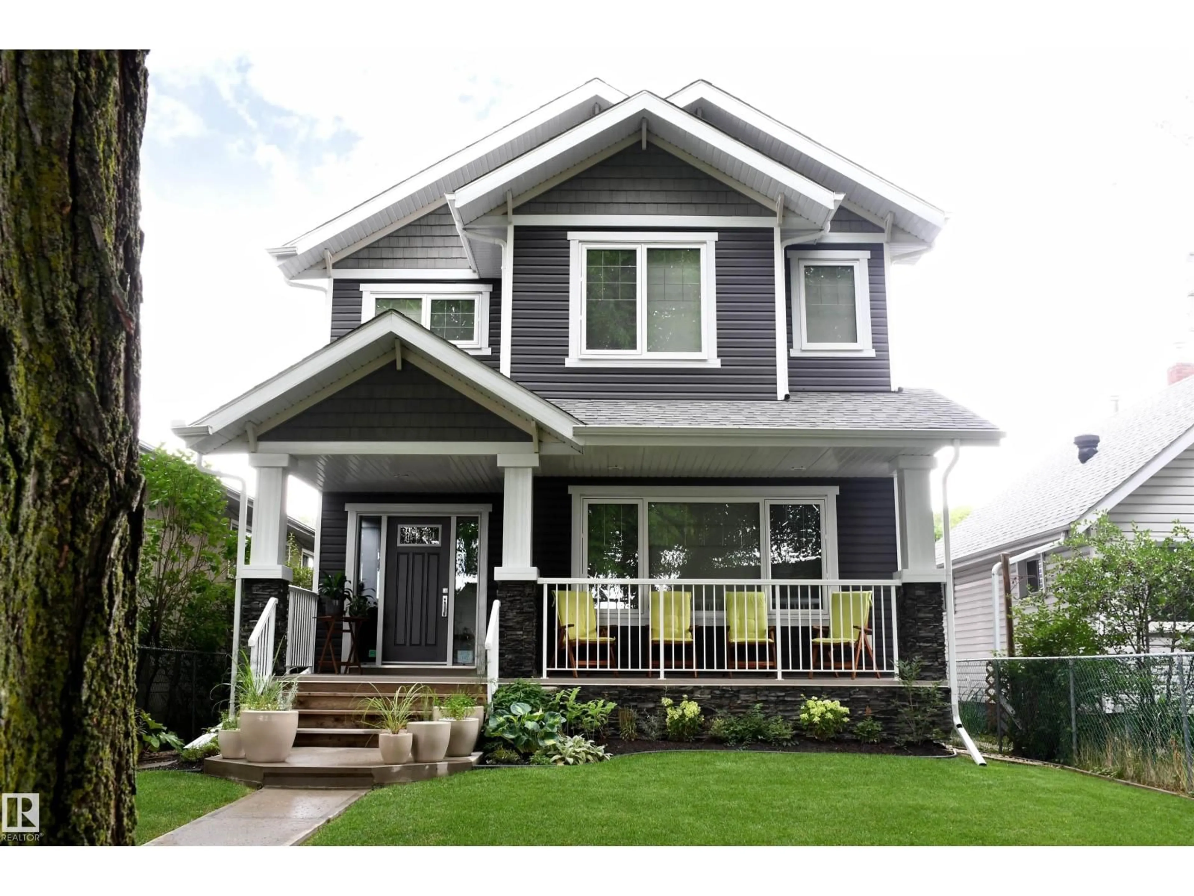 Home with vinyl exterior material, street for NW - 11324 87 ST, Edmonton Alberta T5B3L9