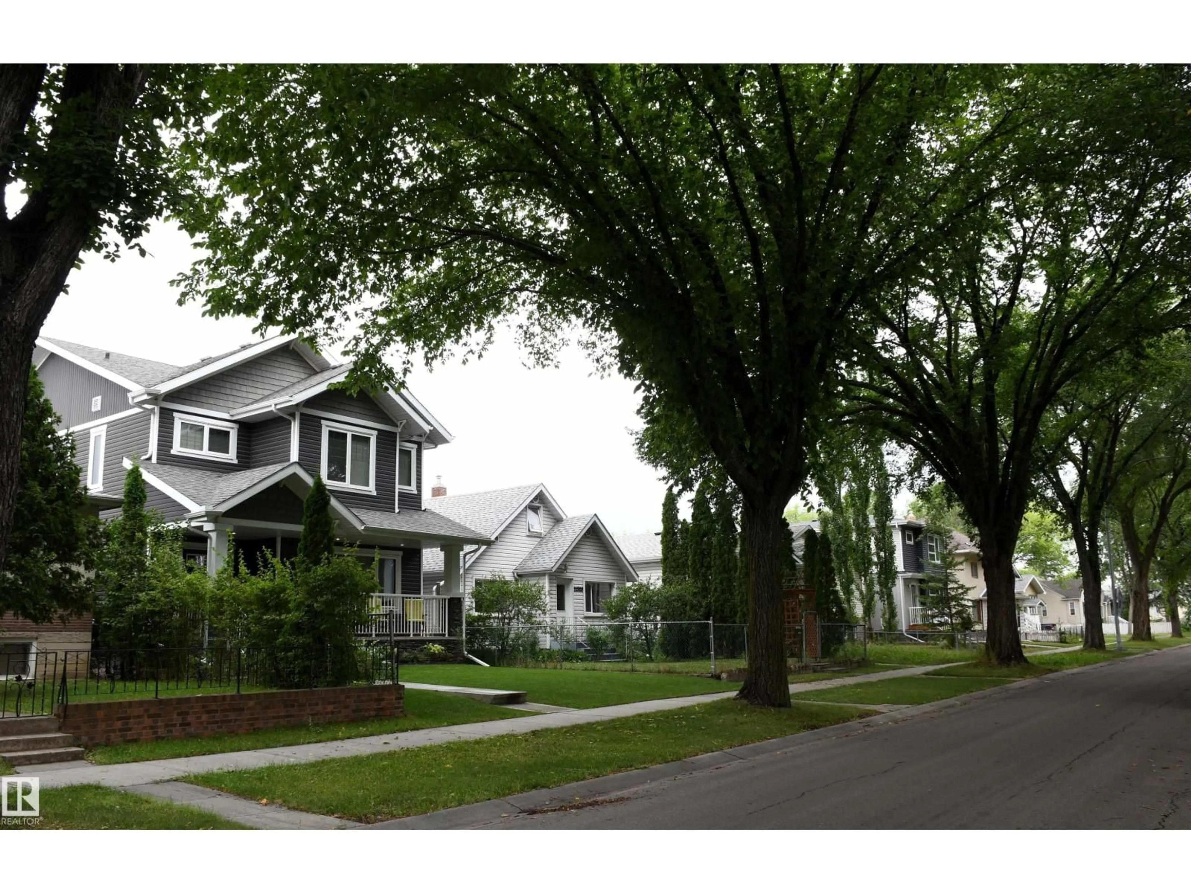 Home with vinyl exterior material, street for NW - 11324 87 ST, Edmonton Alberta T5B3L9