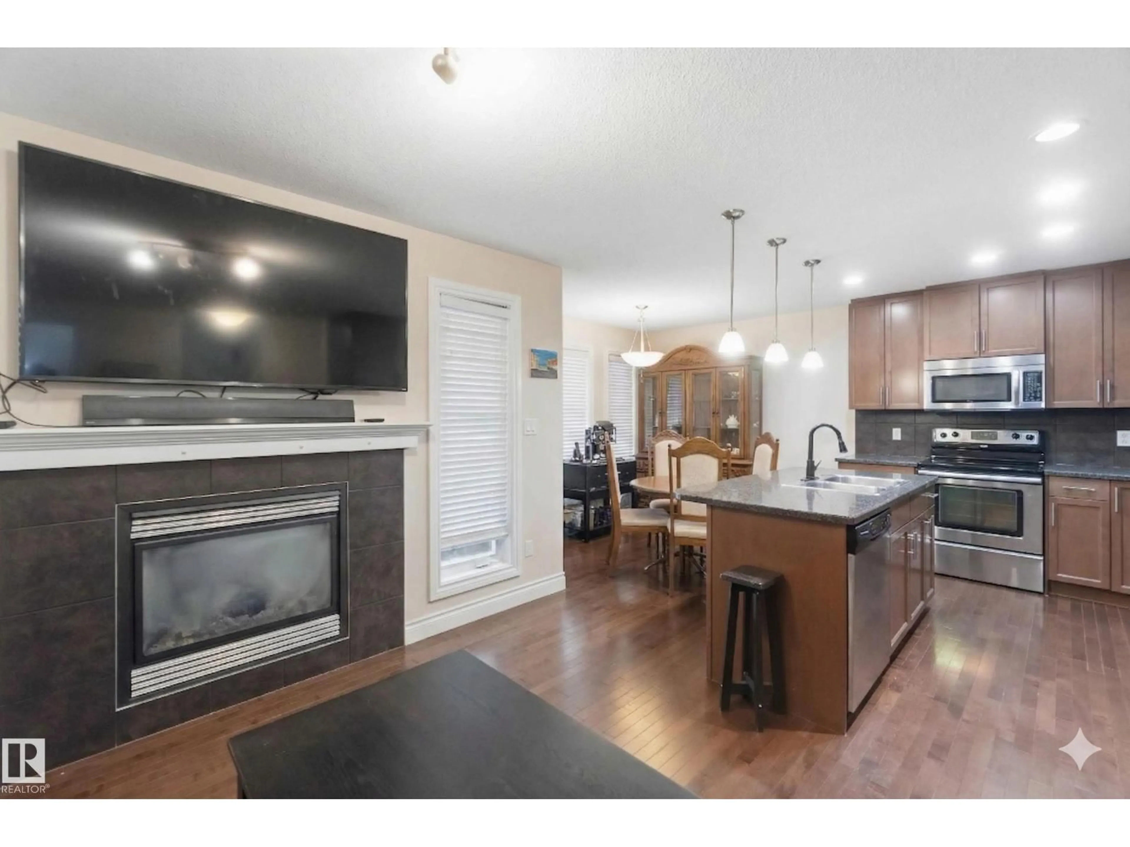 Open concept kitchen, wood/laminate floor for SW - 2037 69A ST, Edmonton Alberta T6X0S5