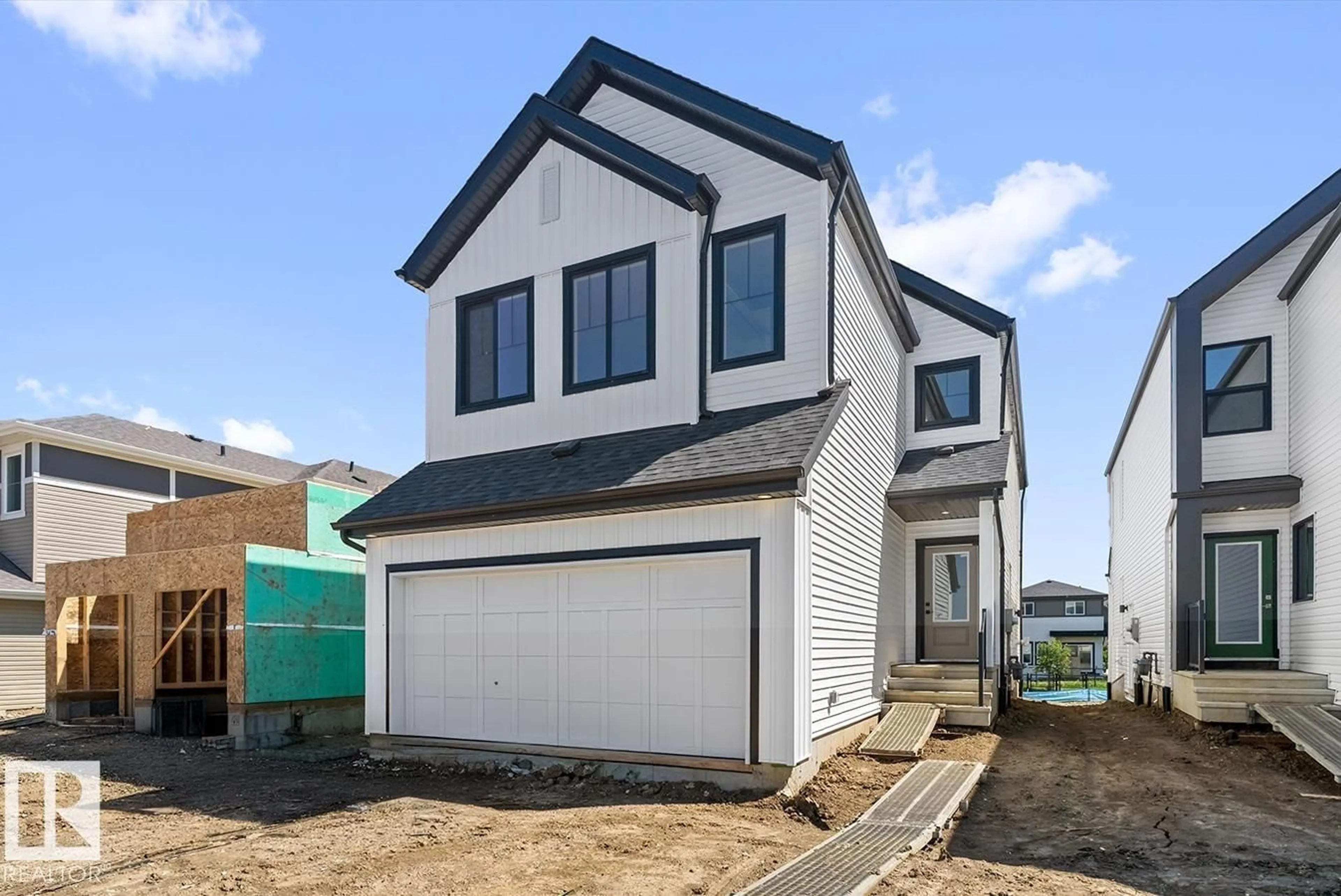 Home with vinyl exterior material, street for SW - 5009 CAWSEY LI, Edmonton Alberta T6W5G4