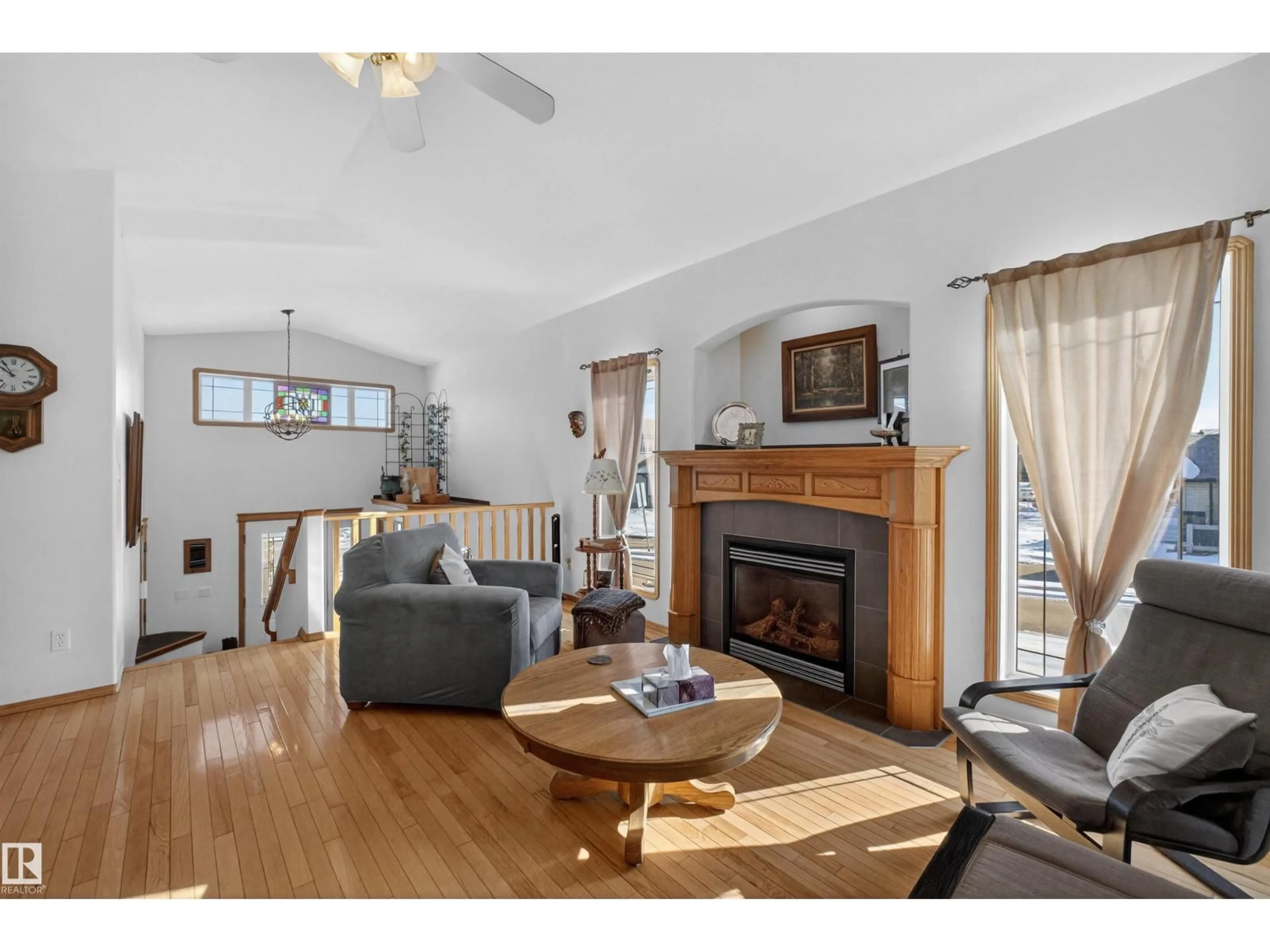 Living room with furniture, wood/laminate floor for 21 HALVERSON CO, Spruce Grove Alberta T7X4P7