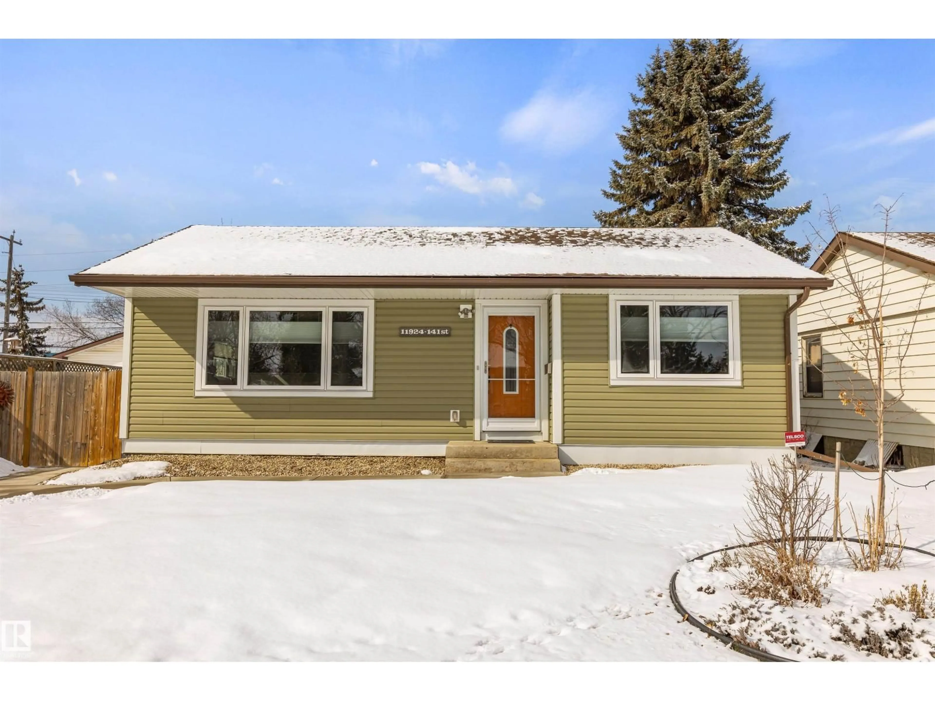 Home with vinyl exterior material, street for 11924 141 ST, Edmonton Alberta T5L2E9