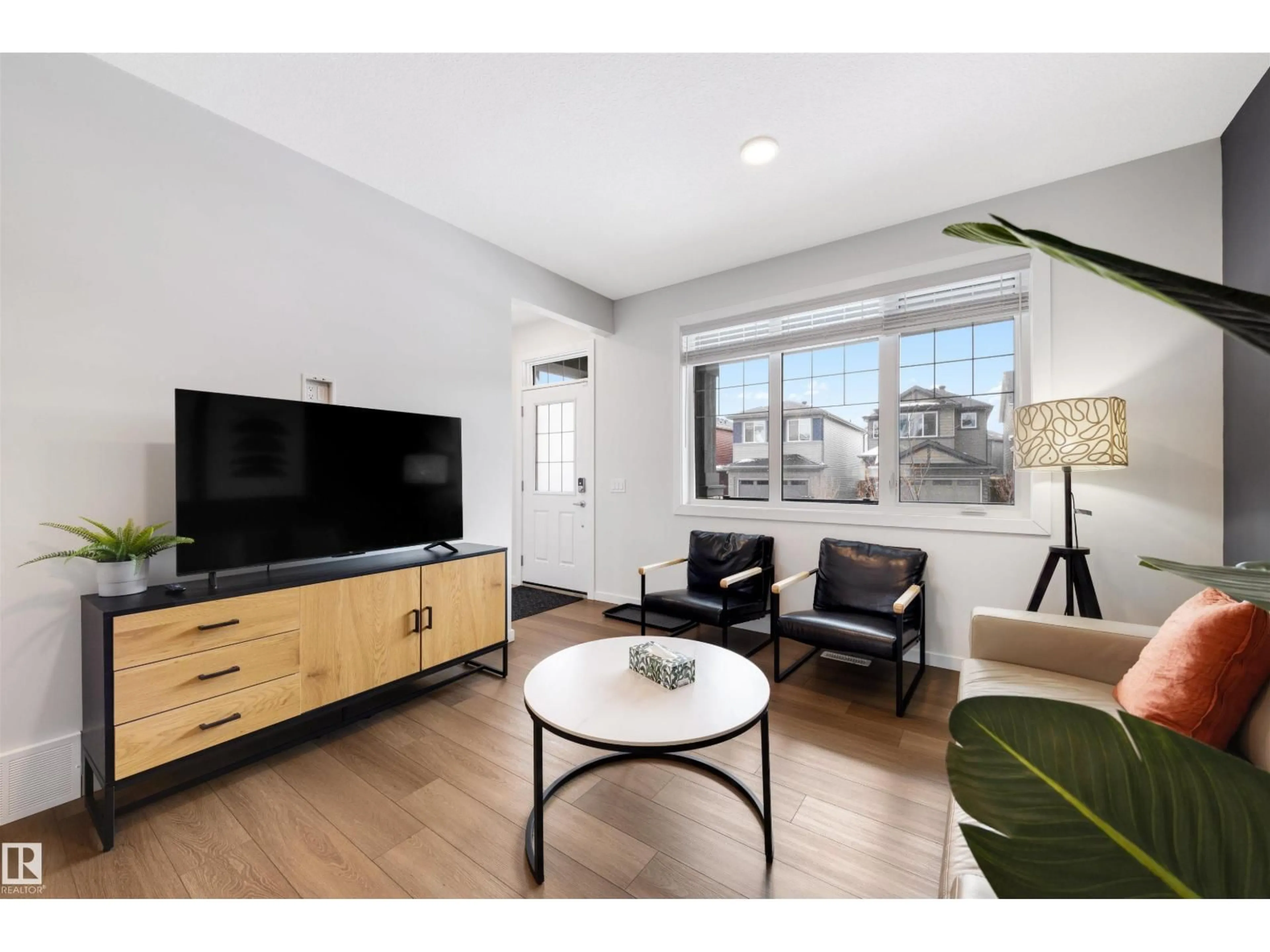 Living room with furniture, wood/laminate floor for NW - 8125 226A ST, Edmonton Alberta T5T7S8