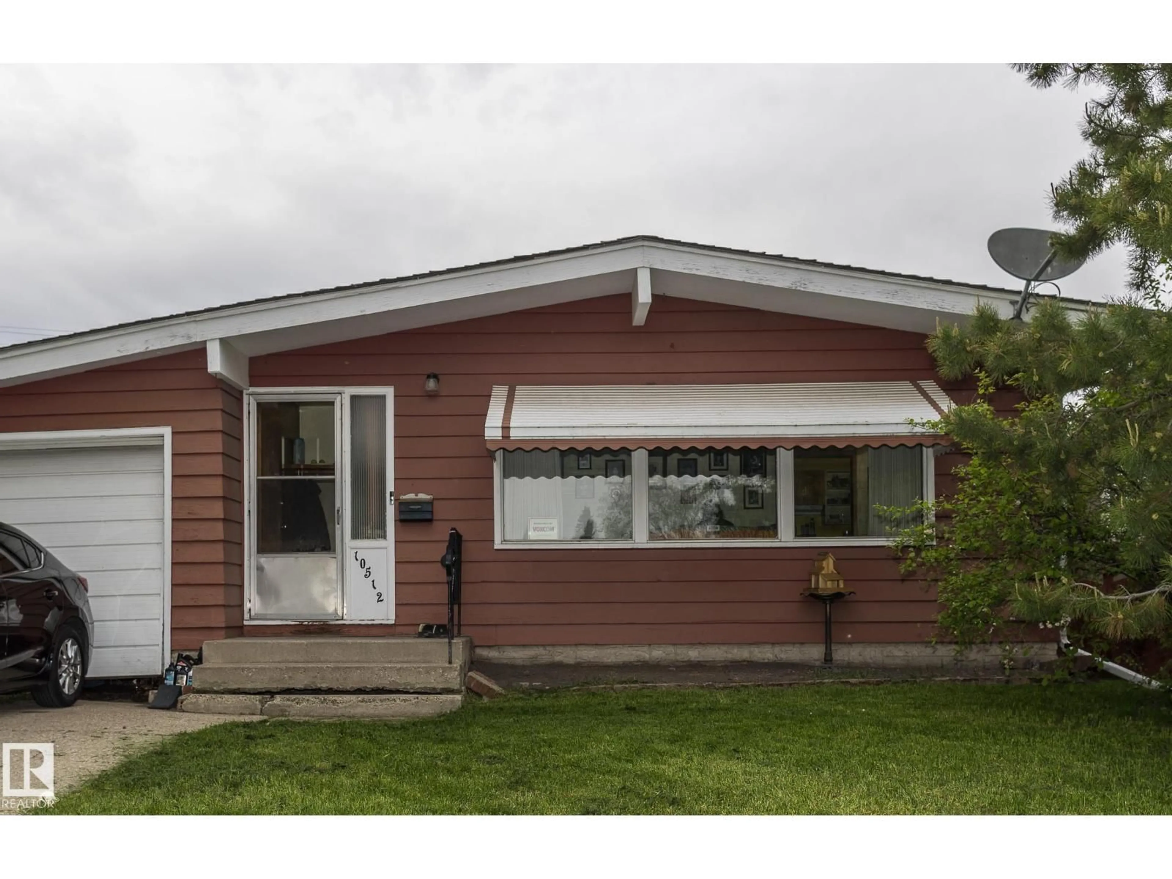Home with vinyl exterior material, street for 10512 55 AV, Edmonton Alberta T6H0W7