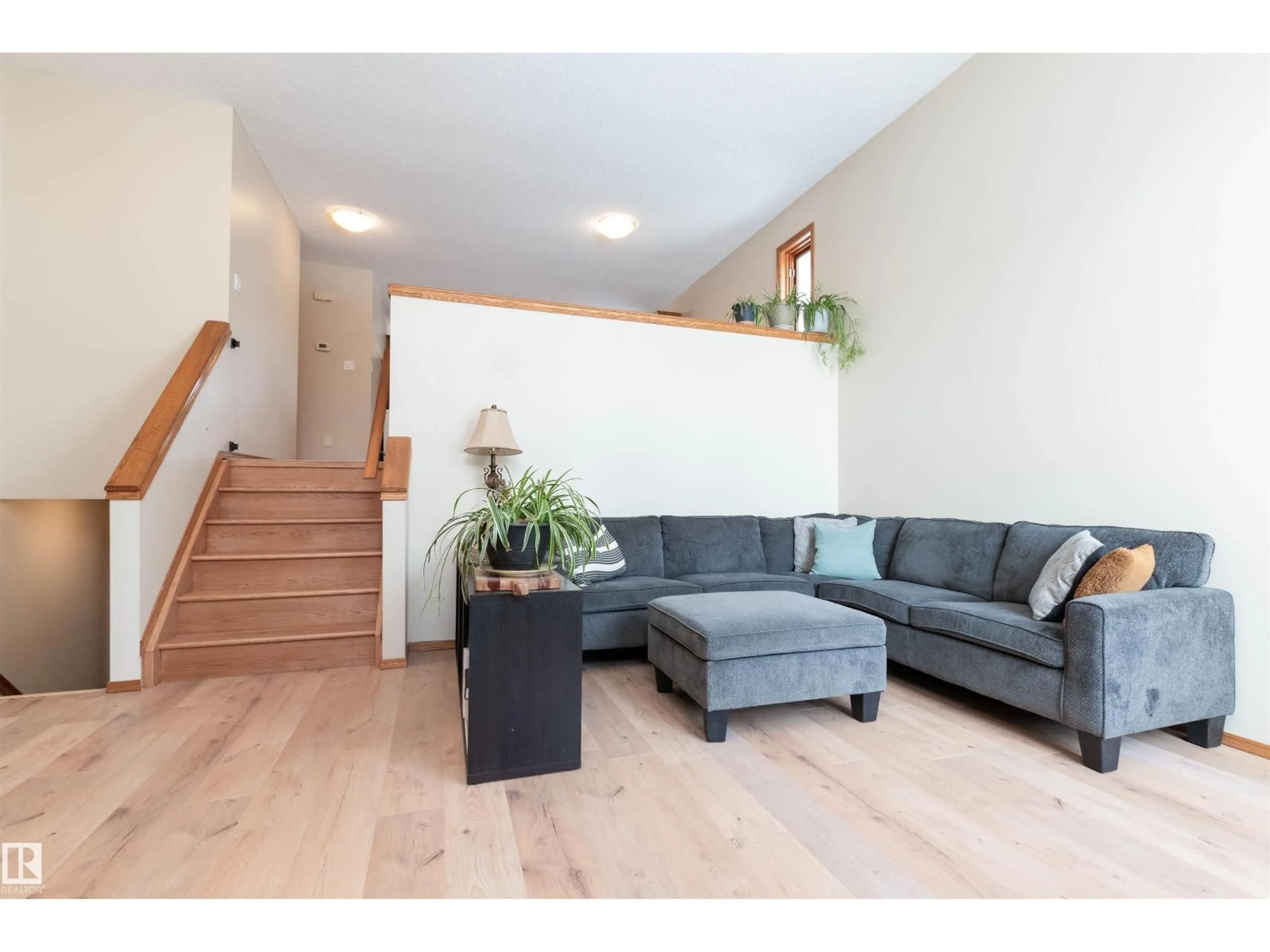 Living room with furniture, wood/laminate floor for 221 GRANDIN DR, Morinville Alberta T8R1H6