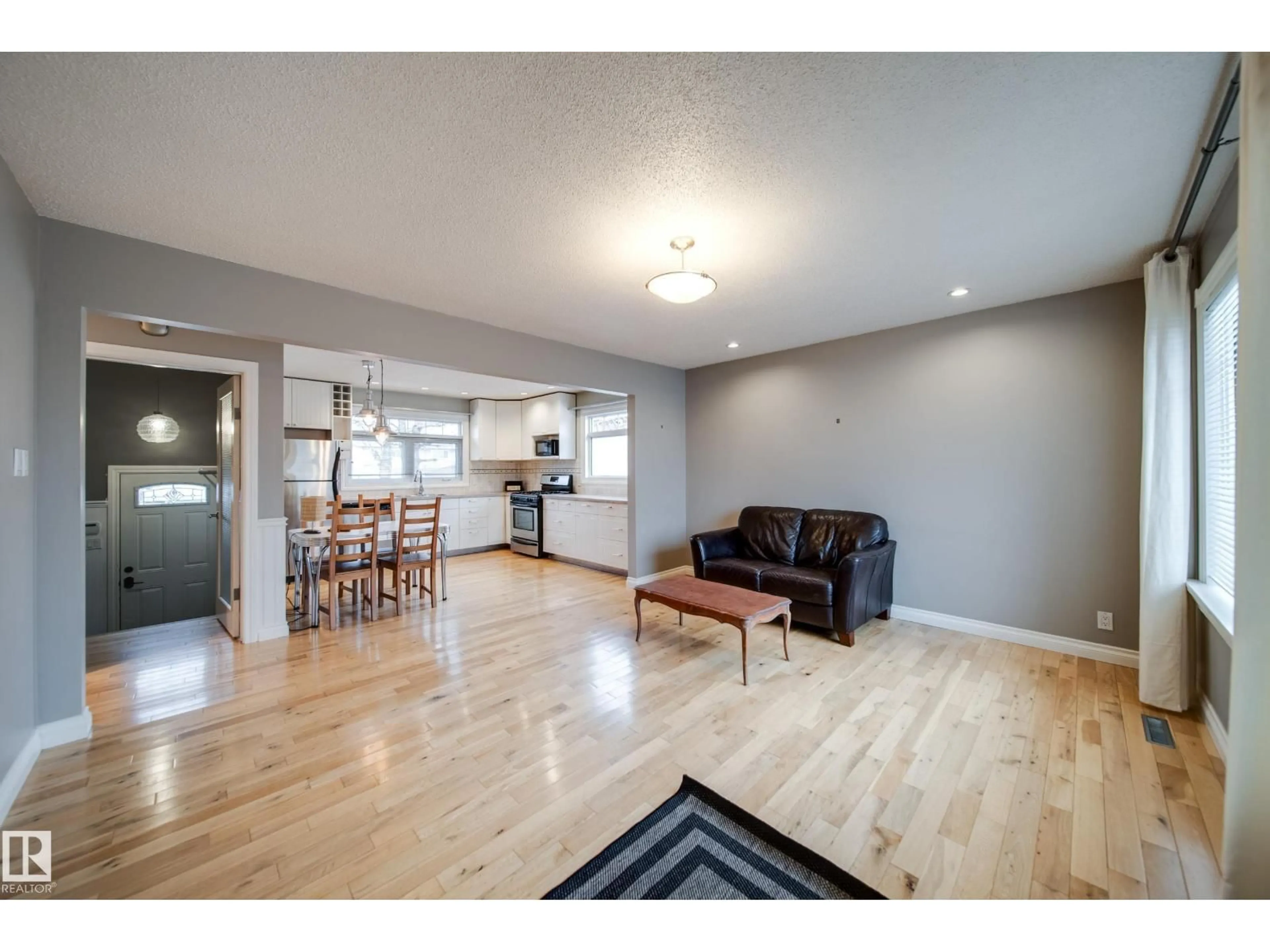 Open concept kitchen, wood/laminate floor for NW - 6052 105B ST, Edmonton Alberta T6H2S5
