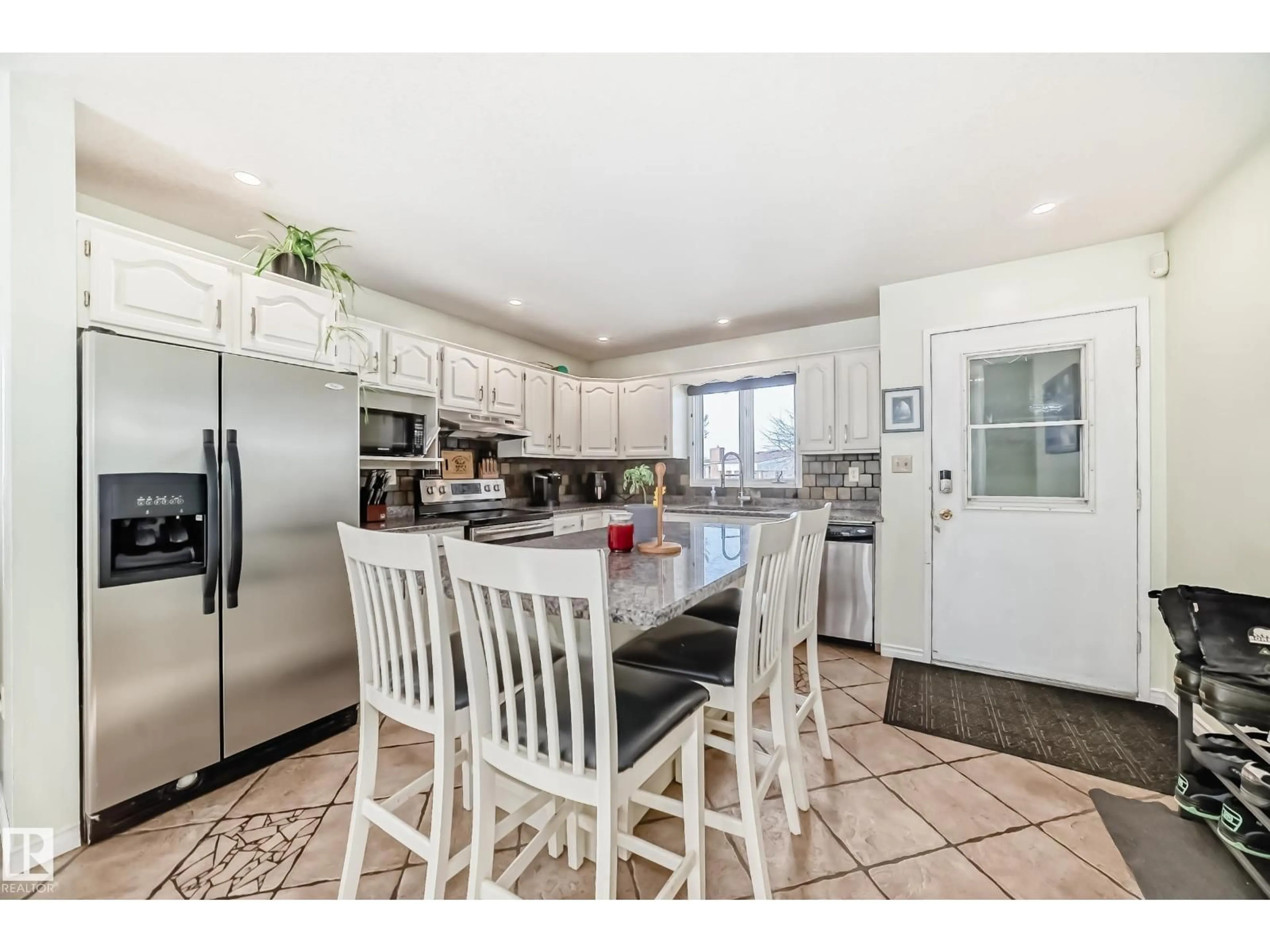 Open concept kitchen, ceramic/tile floor for 16232 100 ST, Edmonton Alberta T5X4R7