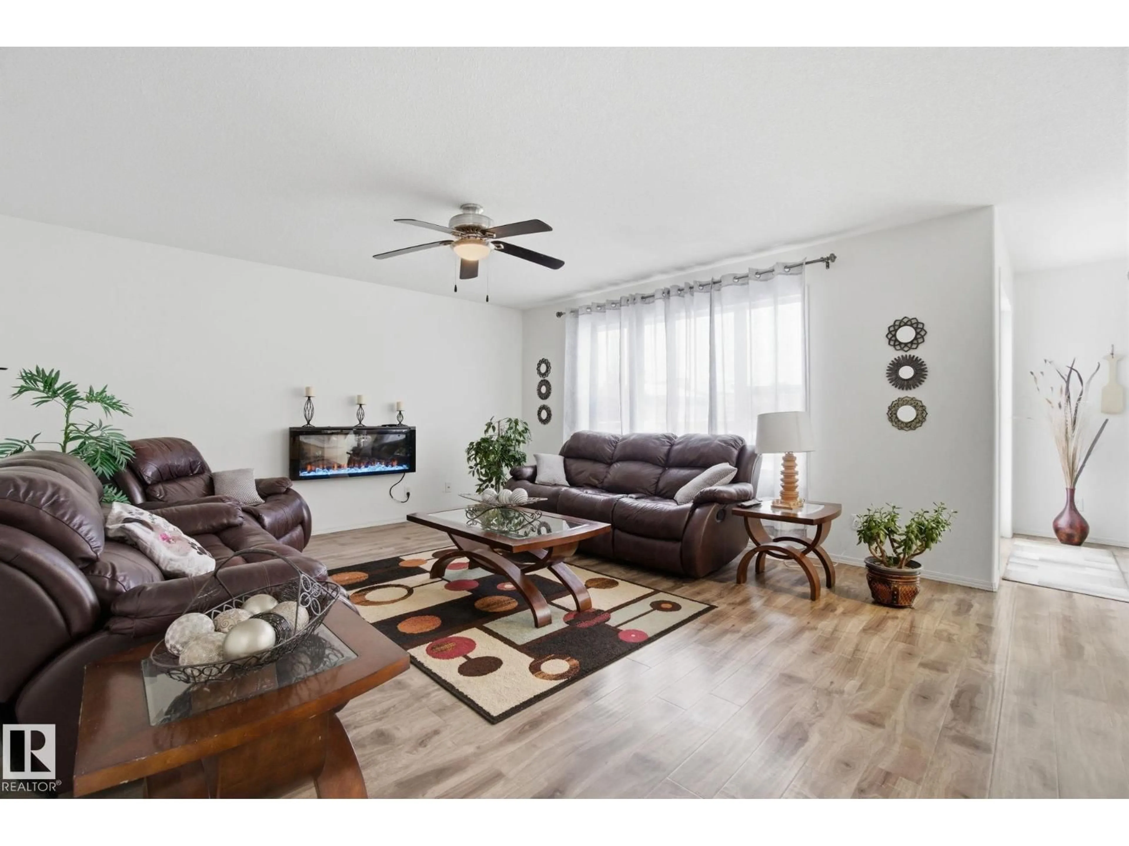 Living room with furniture, wood/laminate floor for 1181 WESTERRA LI, Stony Plain Alberta T7Z2Z4