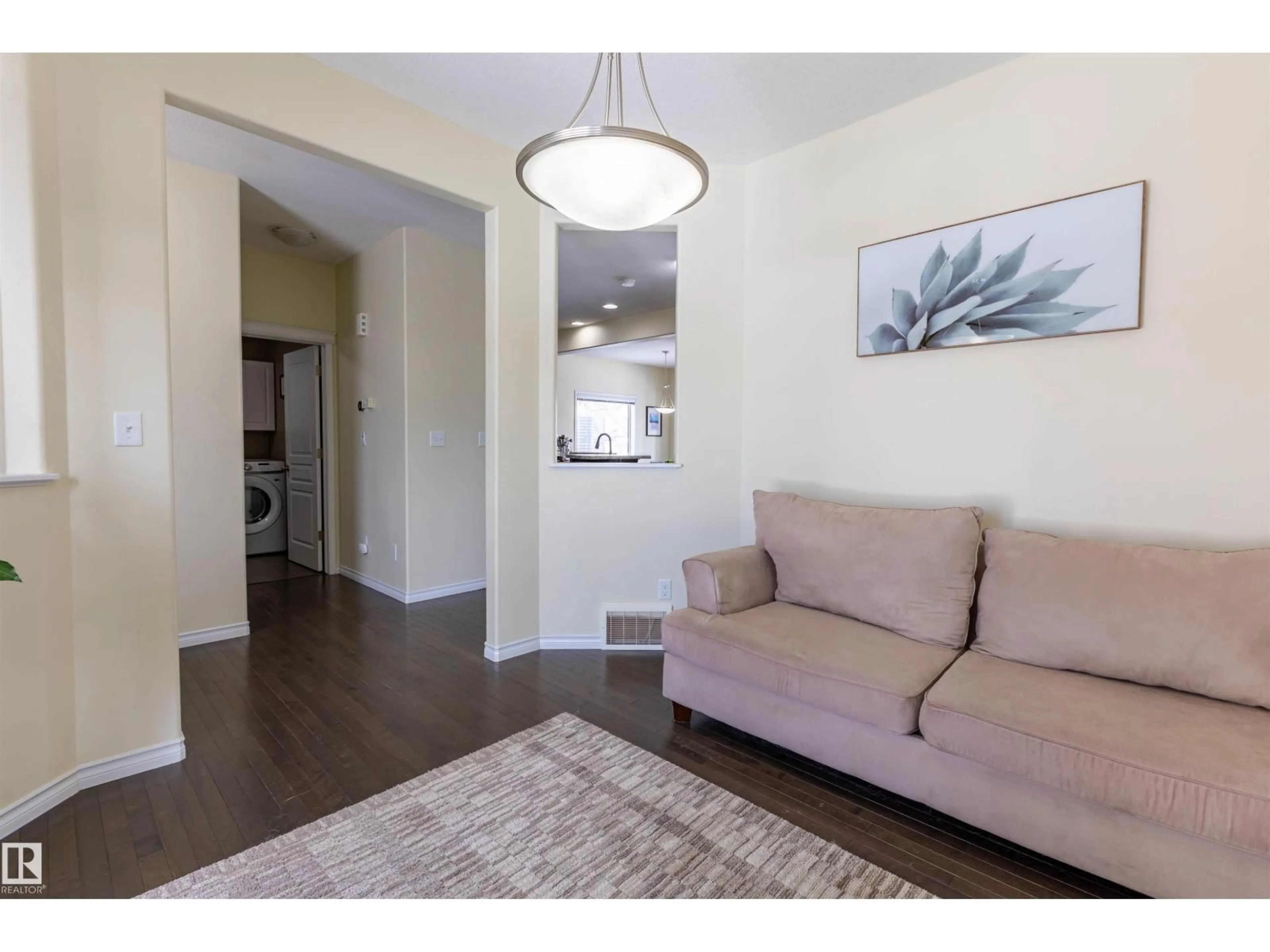 Living room with furniture, wood/laminate floor for 23 EVERITT DR, St. Albert Alberta T8N3L2