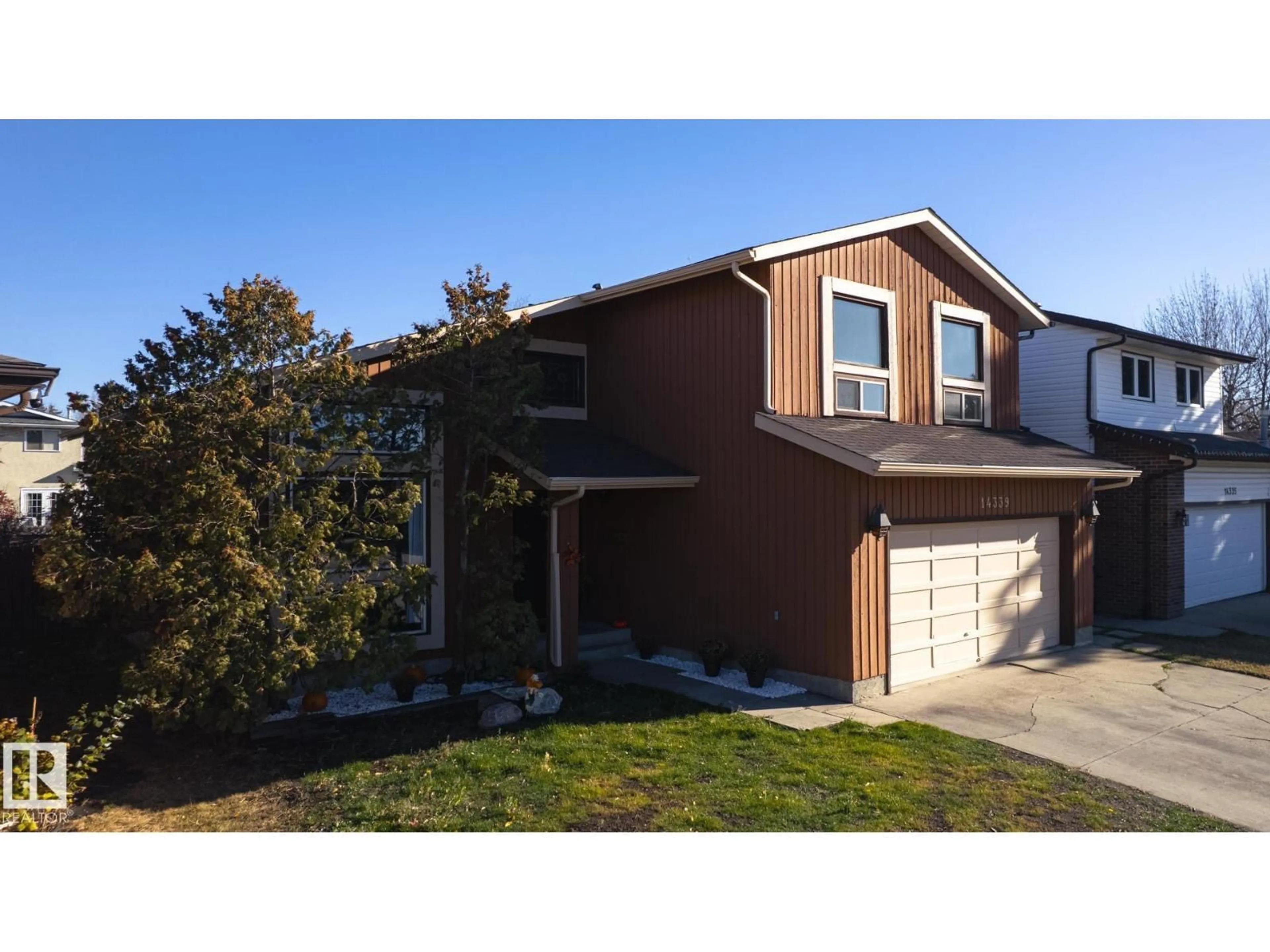 Home with vinyl exterior material, street for NW - 14339 122 ST, Edmonton Alberta T5X3R5