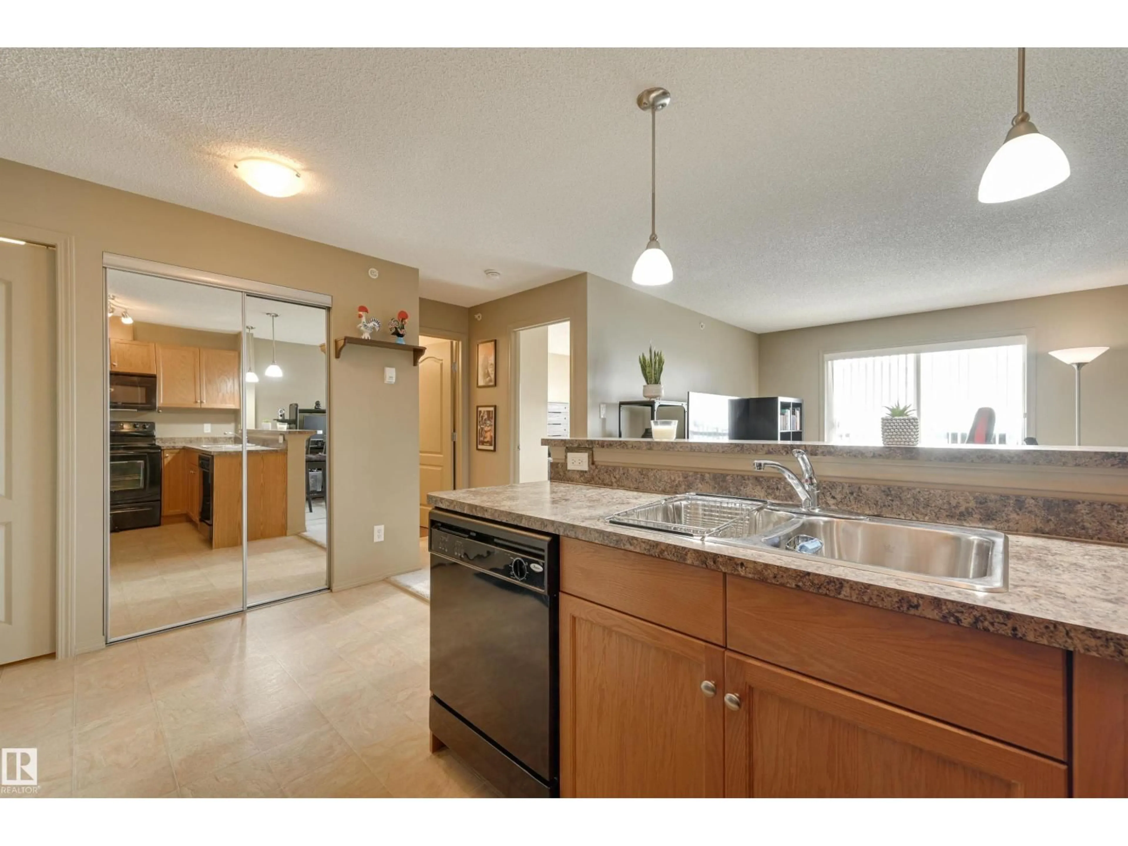 Open concept kitchen, ceramic/tile floor for #424 - 5951 165 AV, Edmonton Alberta T5Y0J6