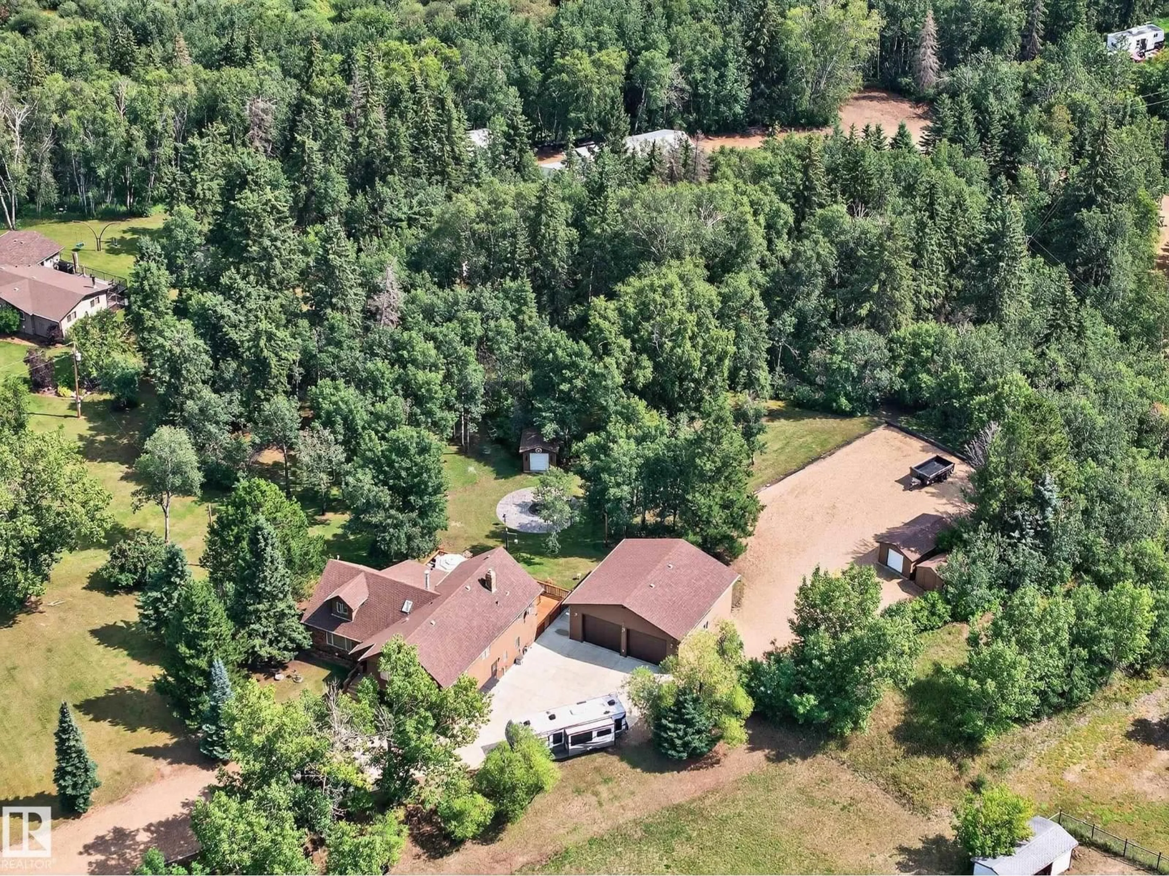 A pic from outside/outdoor area/front of a property/back of a property/a pic from drone, forest/trees view for 55 473084 RGE ROAD 242, Rural Wetaskiwin County Alberta T0C1Z0