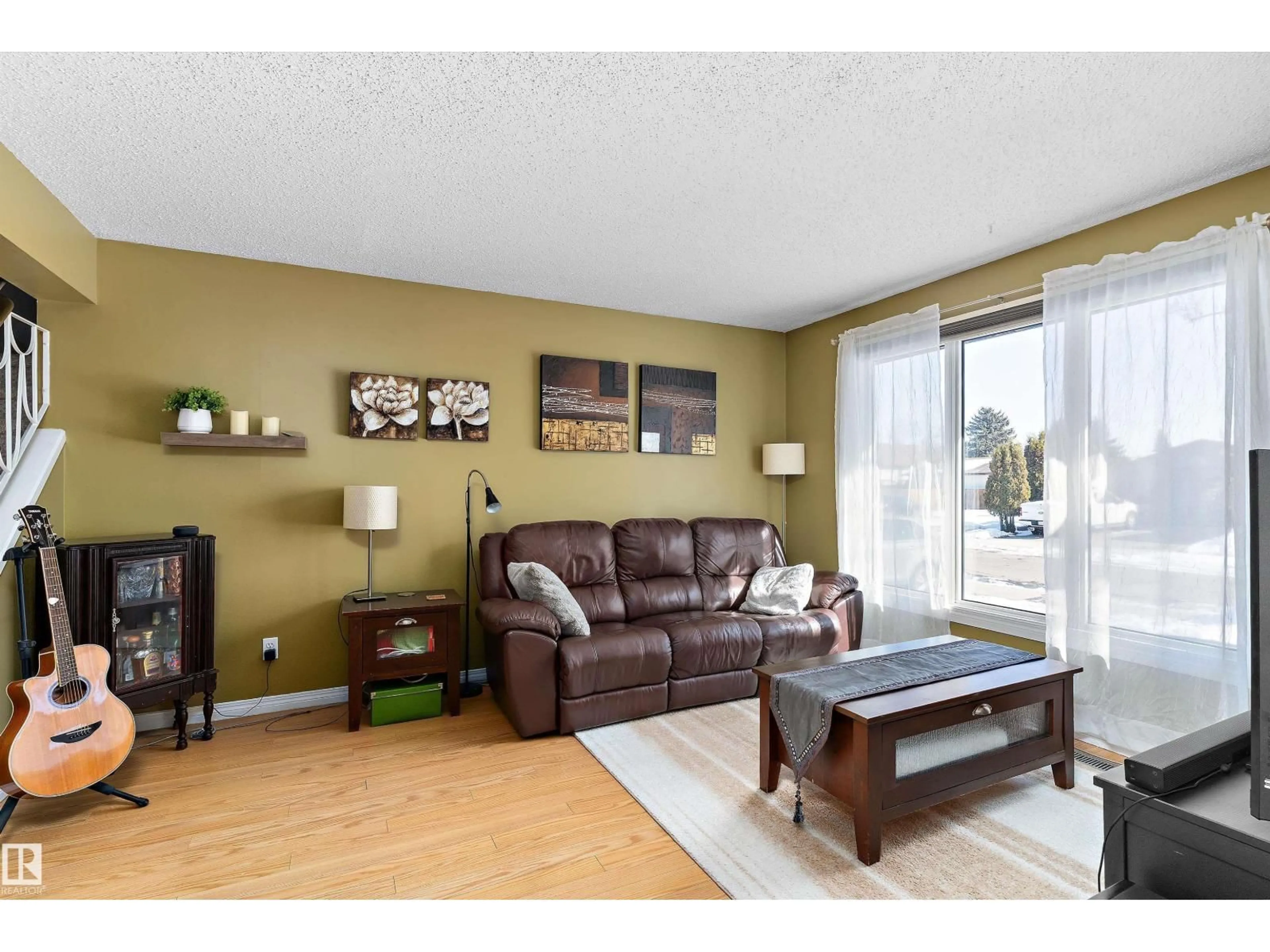 Living room with furniture, wood/laminate floor for 17132 103 ST, Edmonton Alberta T5X4Z4