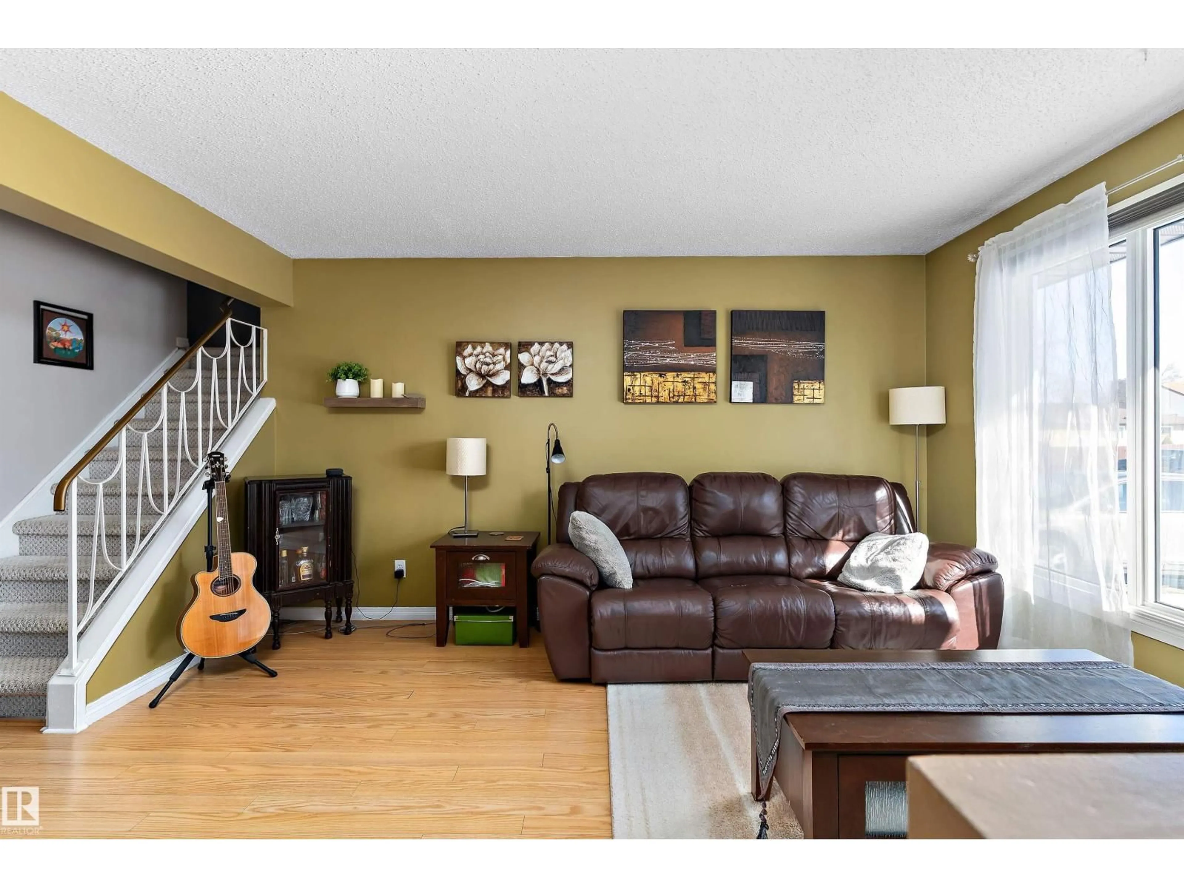 Living room with furniture, wood/laminate floor for 17132 103 ST, Edmonton Alberta T5X4Z4