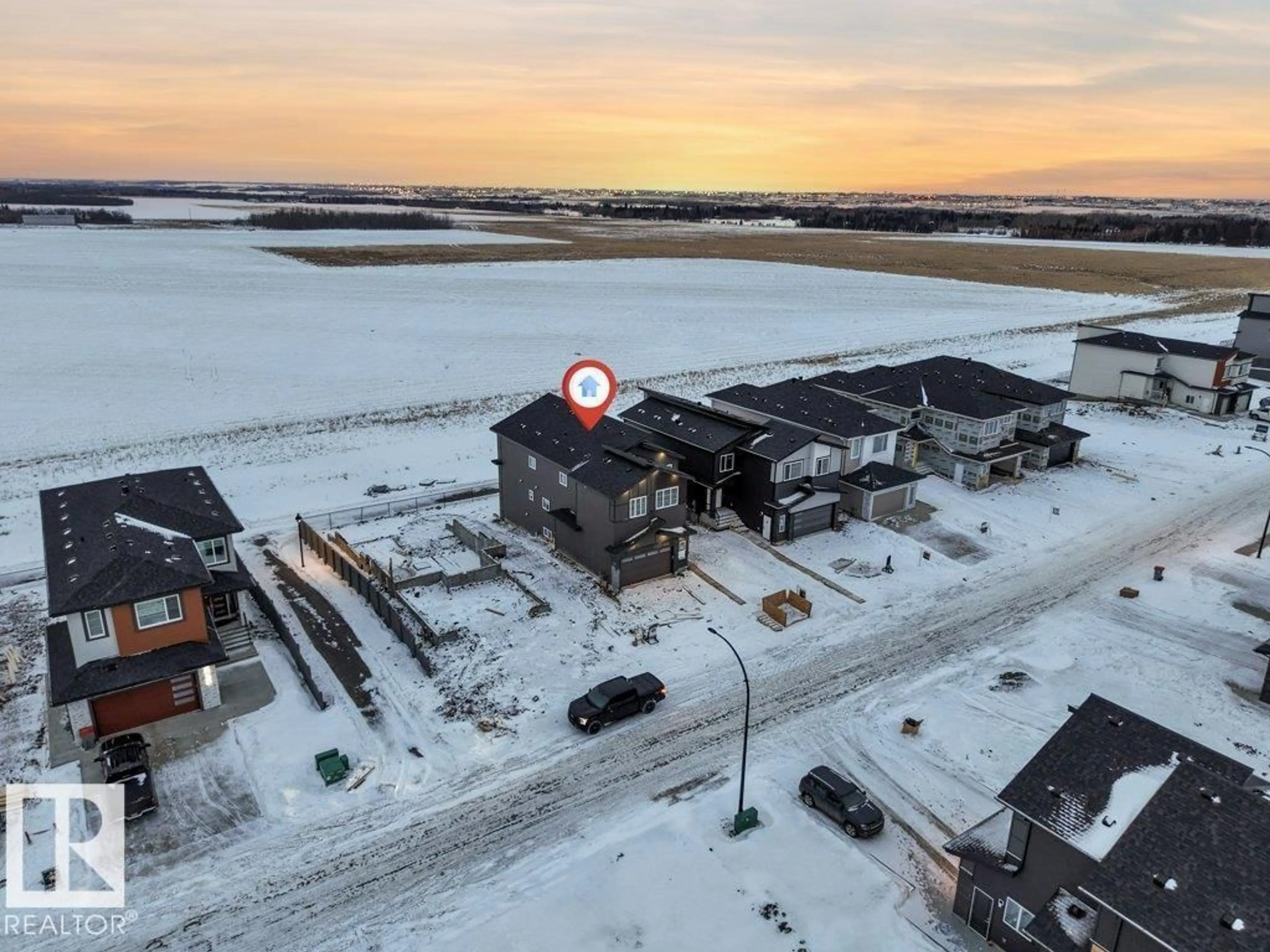 A pic from outside/outdoor area/front of a property/back of a property/a pic from drone, building for NE - 2711 64 AV, Rural Leduc County Alberta T4X2C1