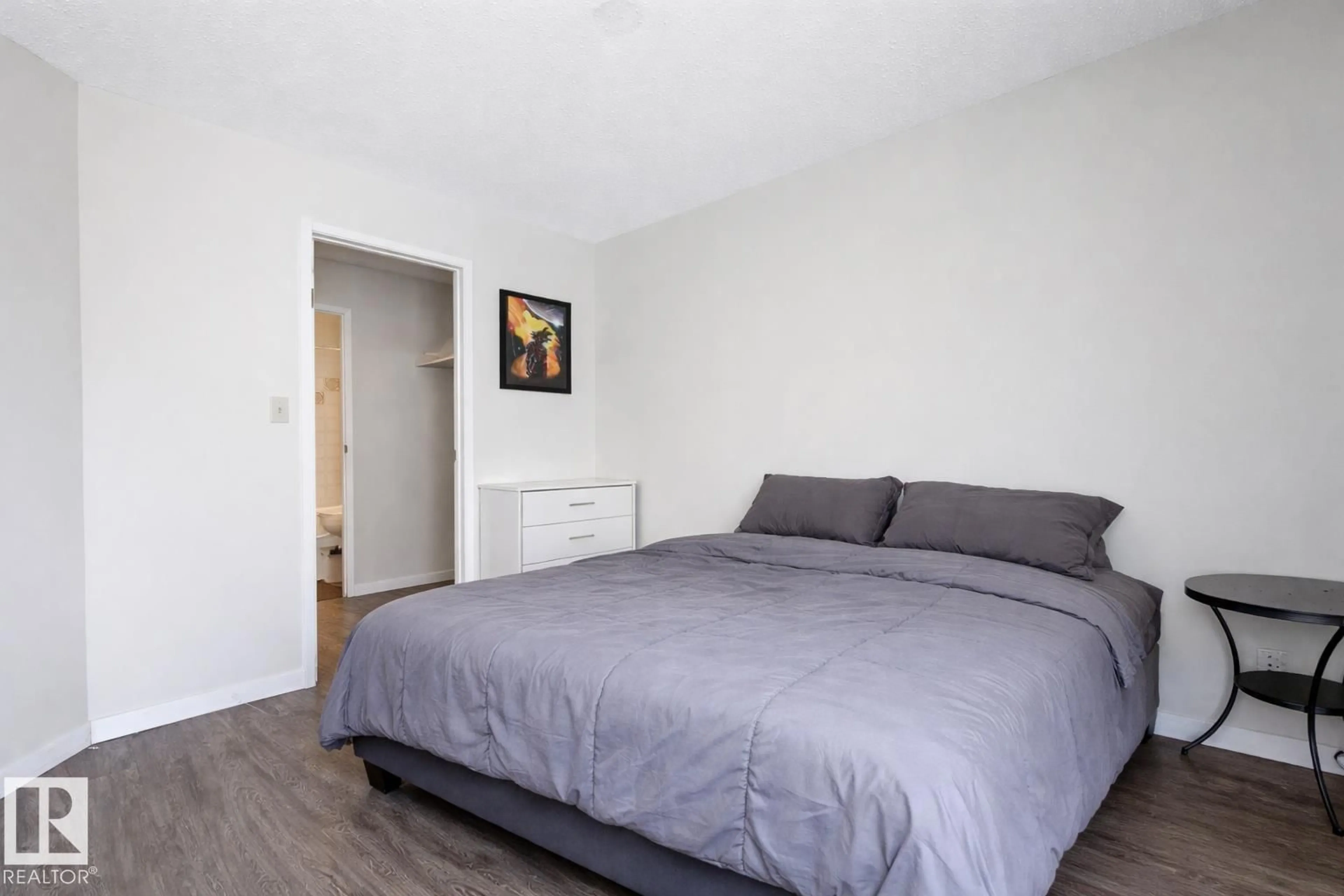 Bedroom with bed, wood/laminate floor for #302 - 6204 180 ST, Edmonton Alberta T5T3J9