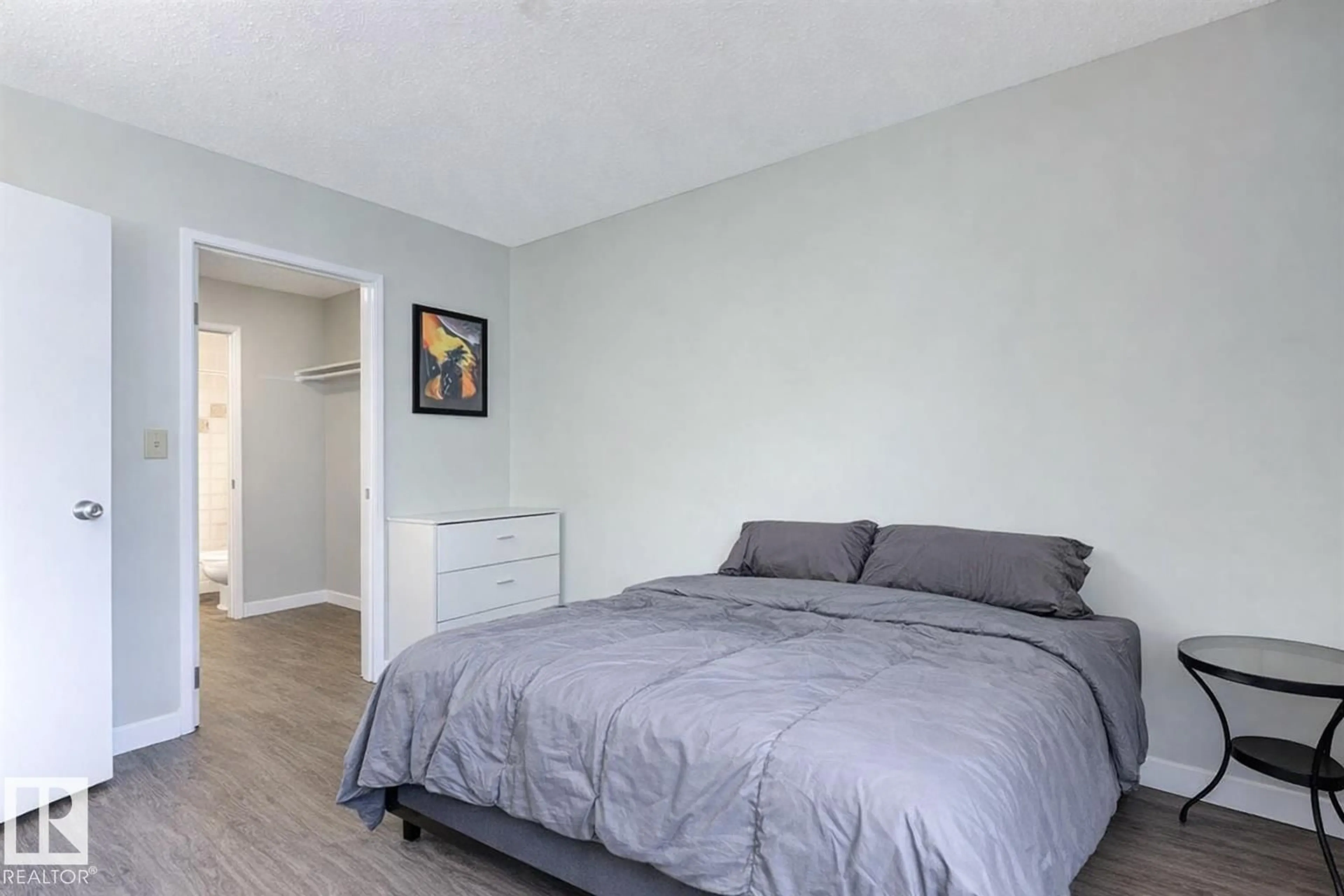Bedroom with bed, wood/laminate floor for #302 - 6204 180 ST, Edmonton Alberta T5T3J9