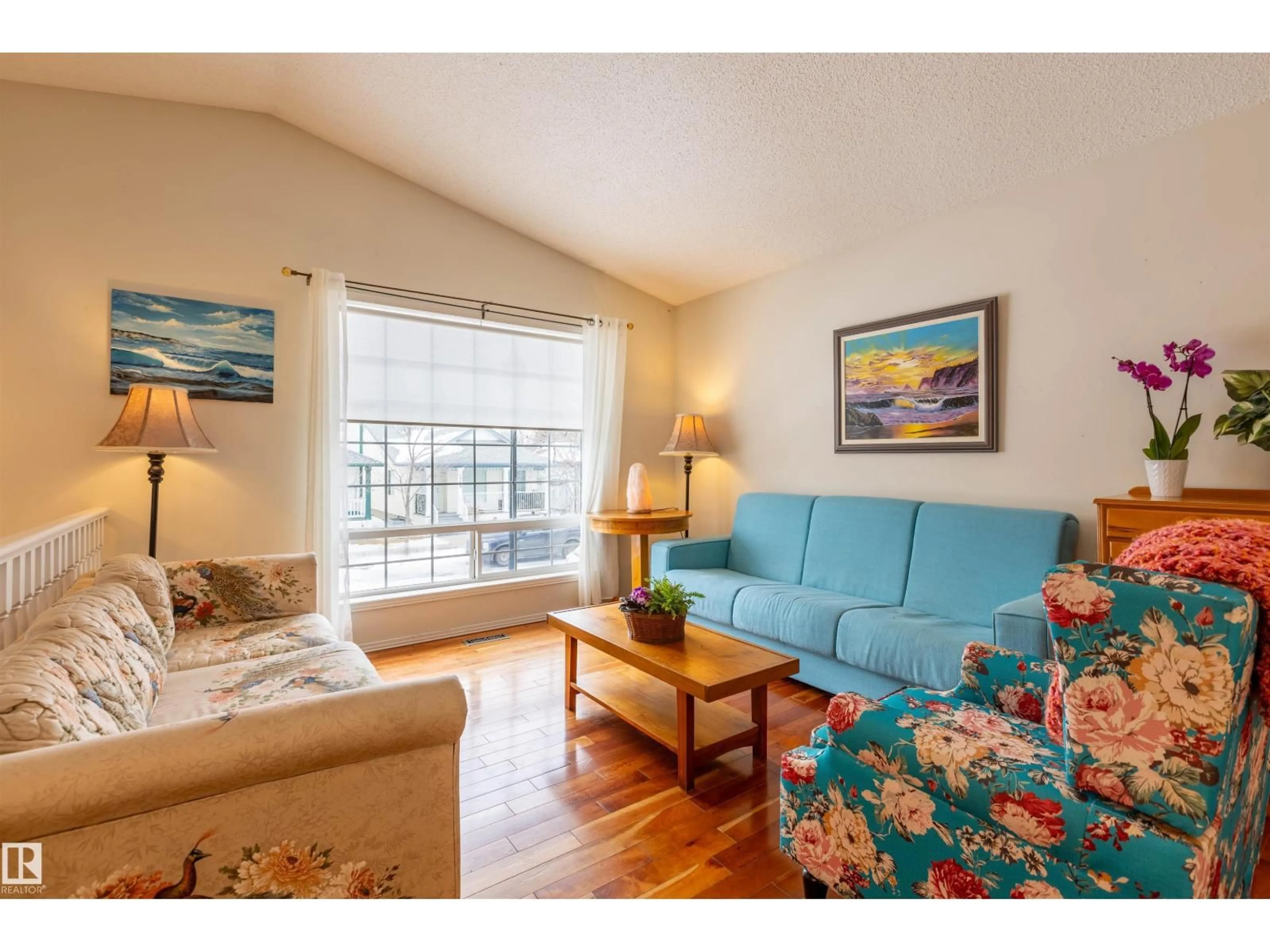 Living room with furniture, wood/laminate floor for NW - 1712 TURVEY BN, Edmonton Alberta T6R2W7