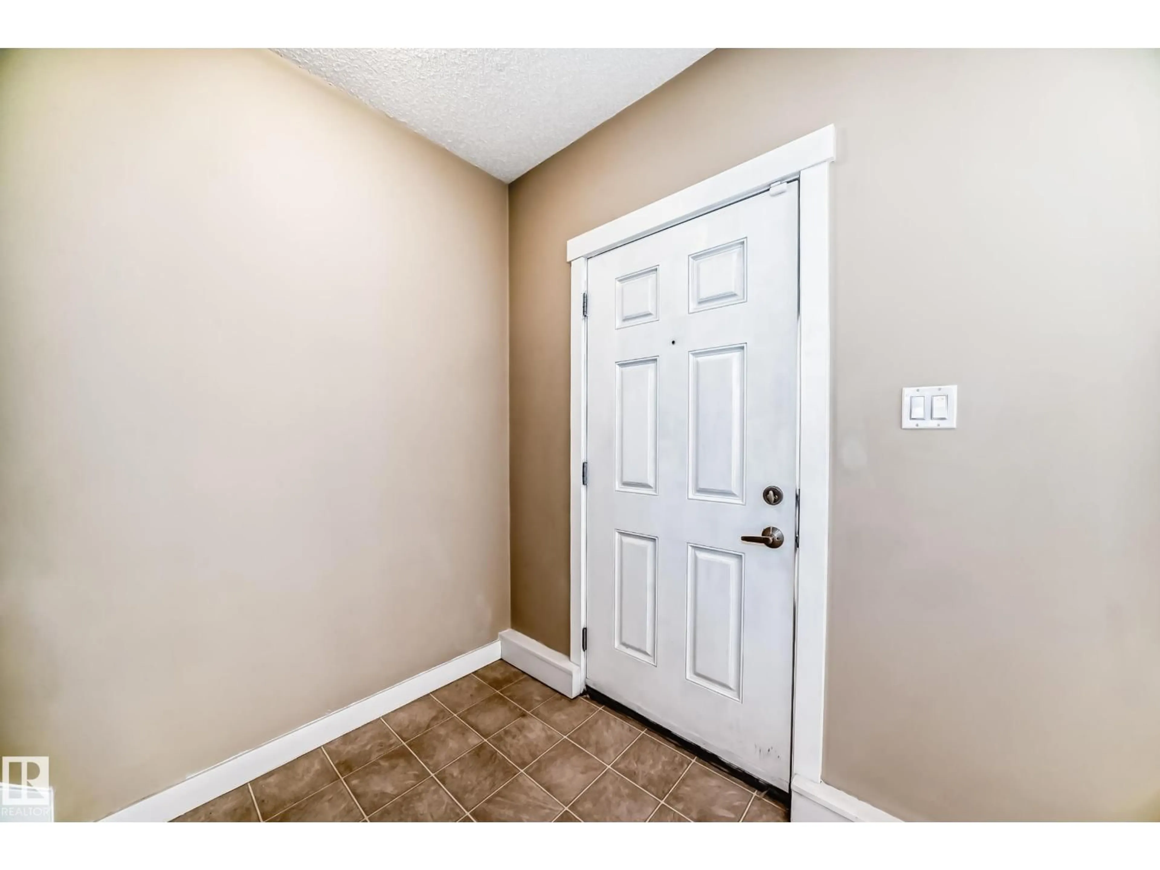 Indoor entryway for #65 - 8315 180 AV NW, Edmonton Alberta T7Z0J2