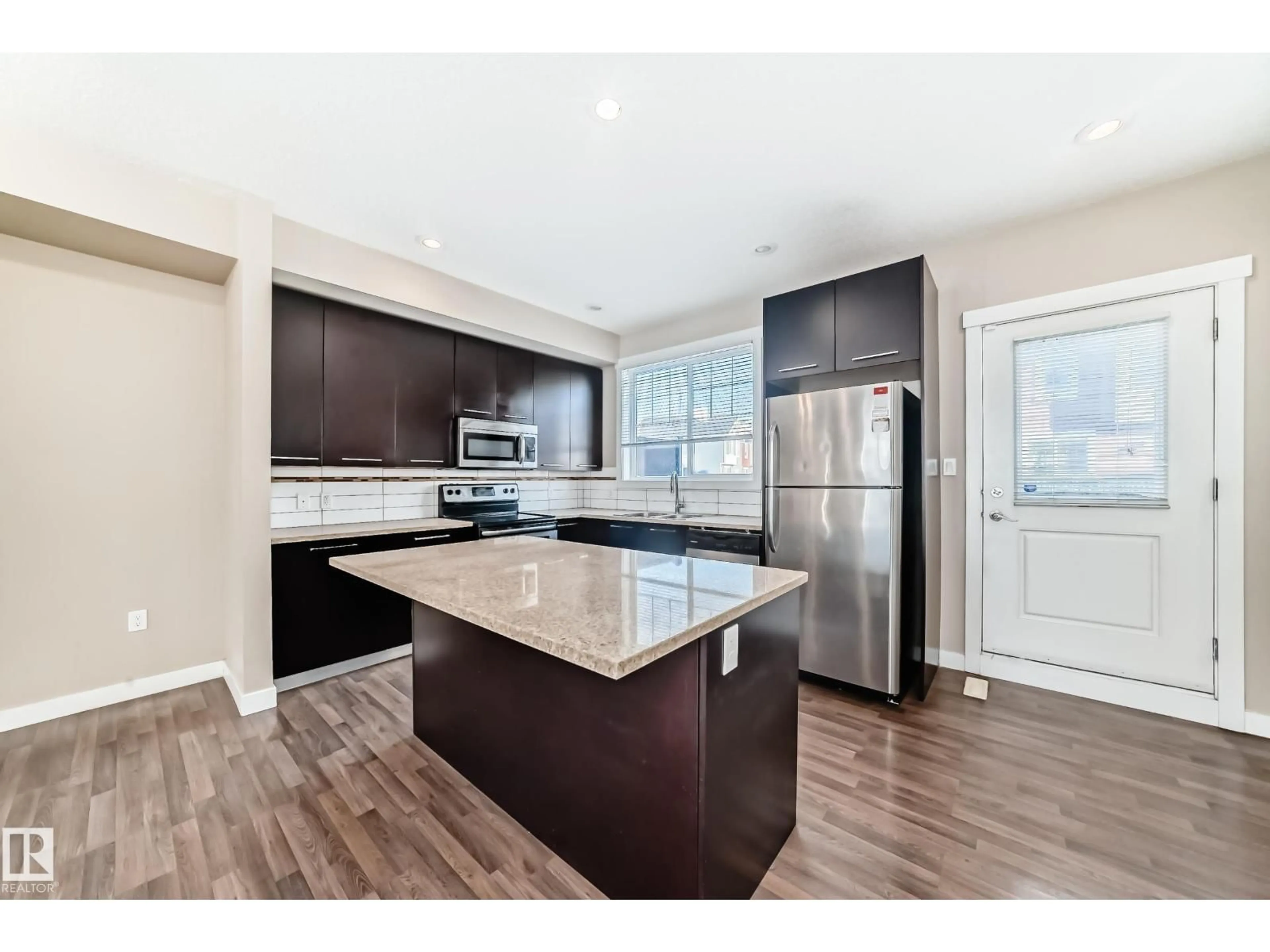 Open concept kitchen, unknown for #65 - 8315 180 AV NW, Edmonton Alberta T7Z0J2