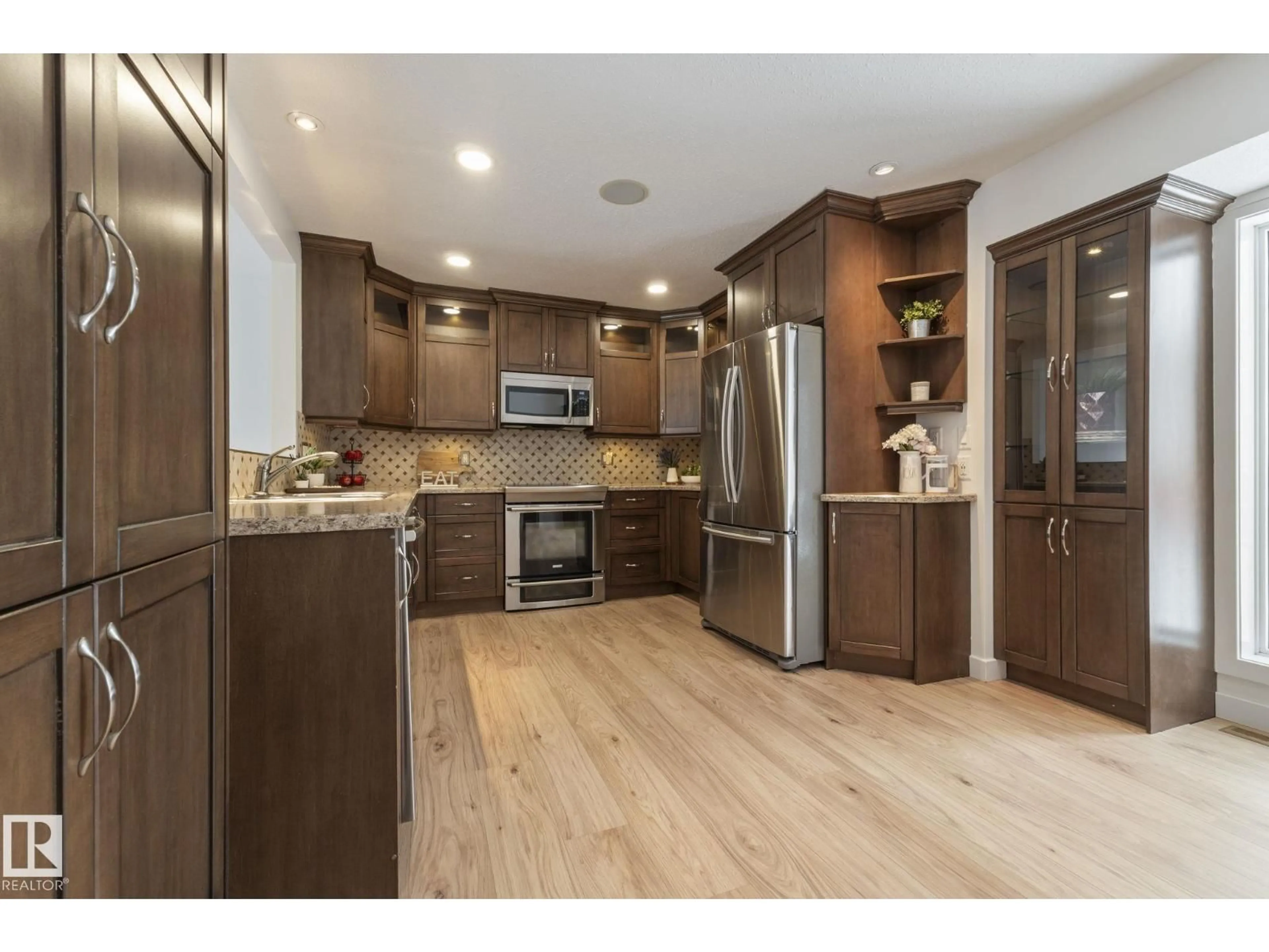 Open concept kitchen, wood/laminate floor for NW - 17815 62C AV, Edmonton Alberta T5T4E8