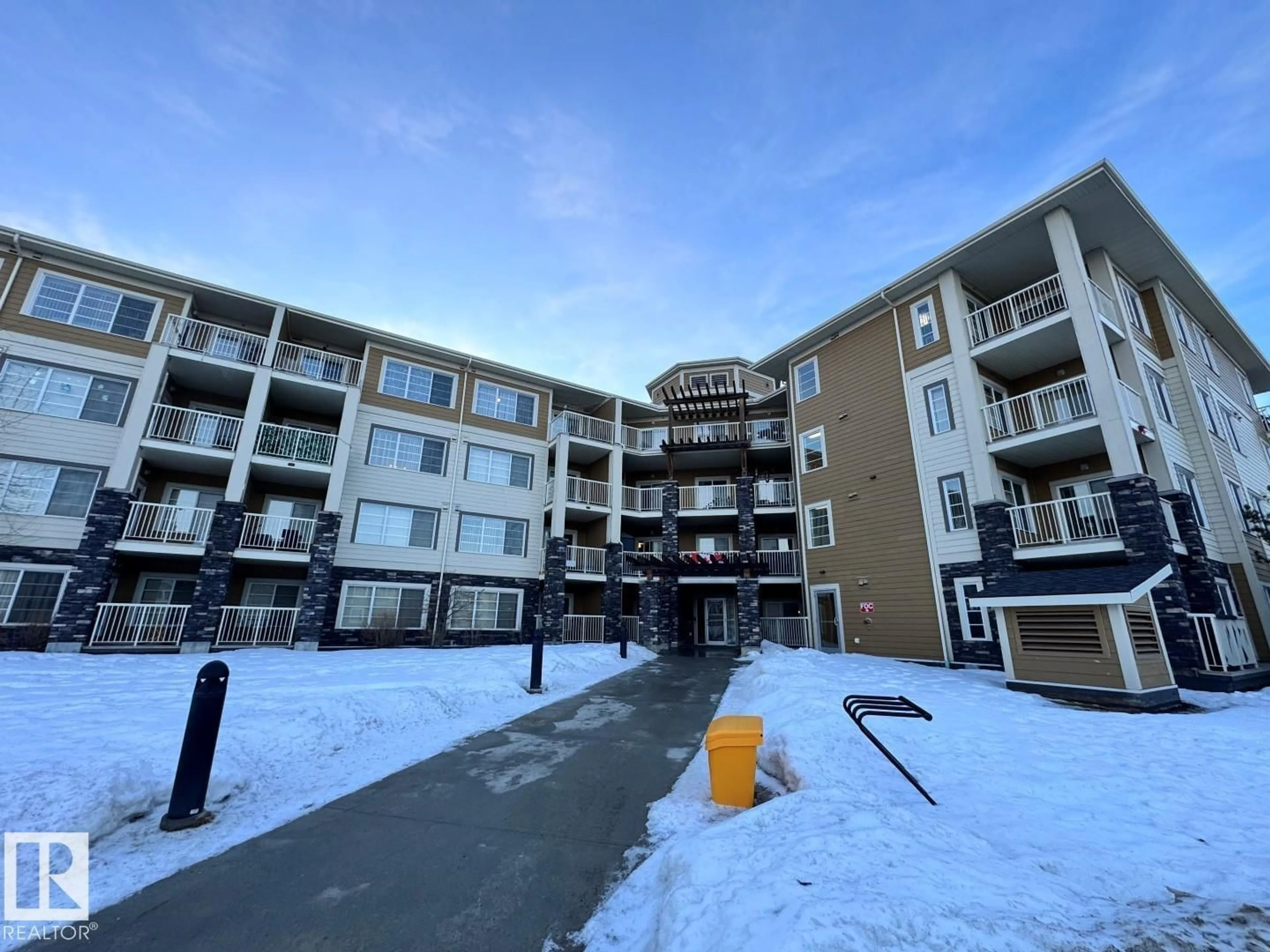 A pic from outside/outdoor area/front of a property/back of a property/a pic from drone, building for 405 - 3670 139 AV NW, Edmonton Alberta T5Y3N5