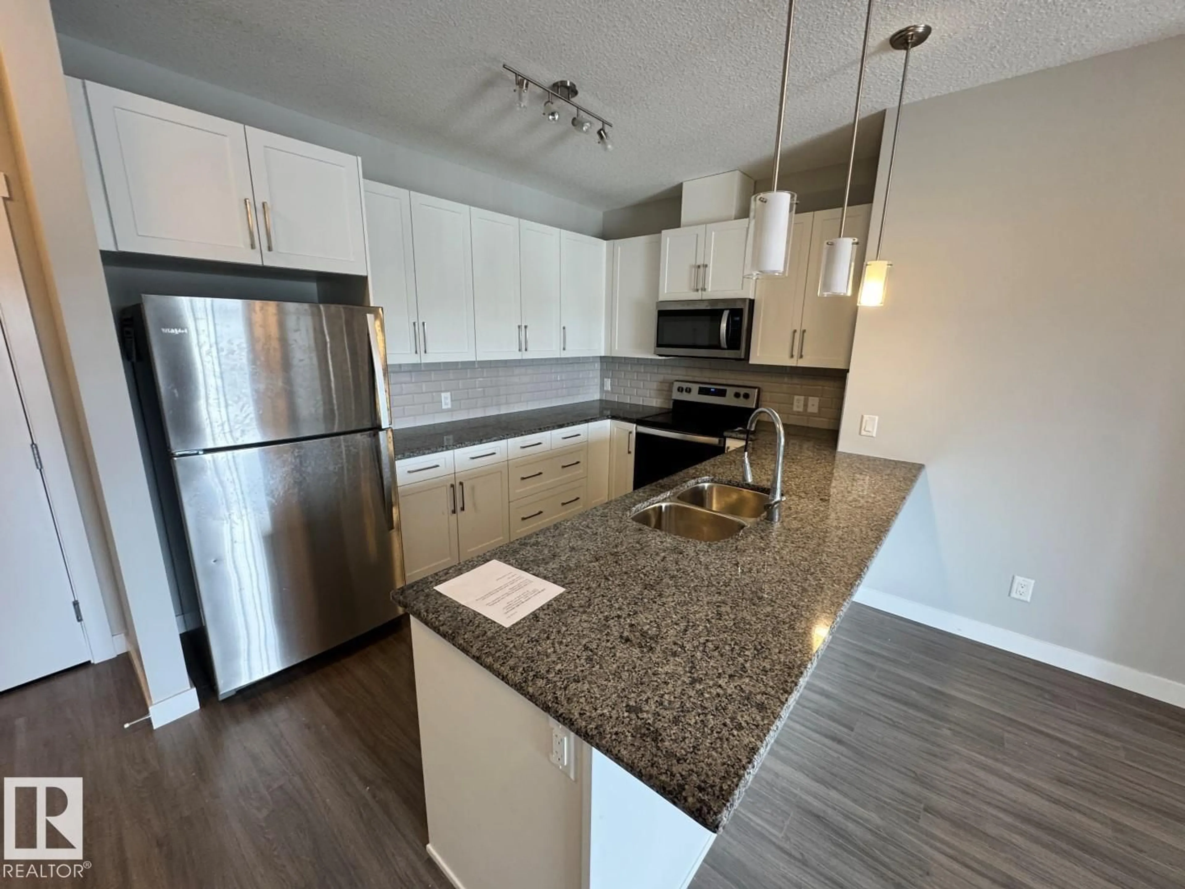 Open concept kitchen, unknown for 405 - 3670 139 AV NW, Edmonton Alberta T5Y3N5