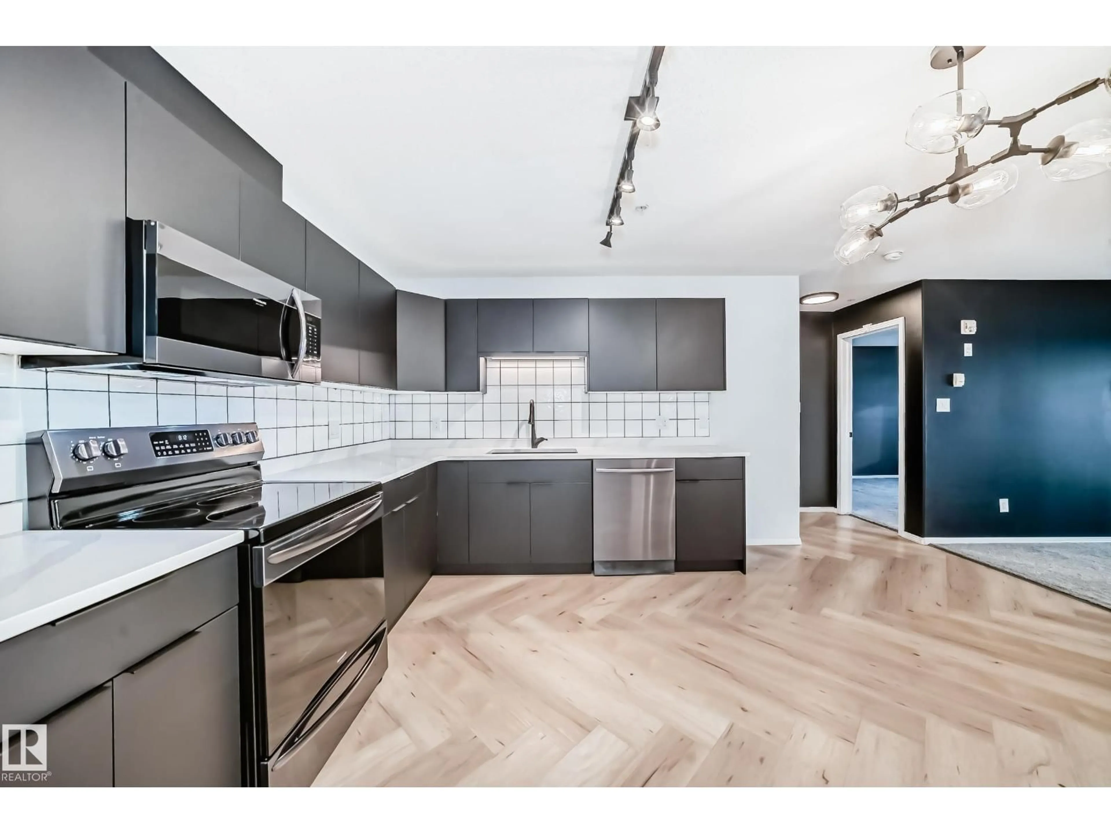 Open concept kitchen, ceramic/tile floor for #320 - 592 HOOKE RD, Edmonton Alberta T5A5H2