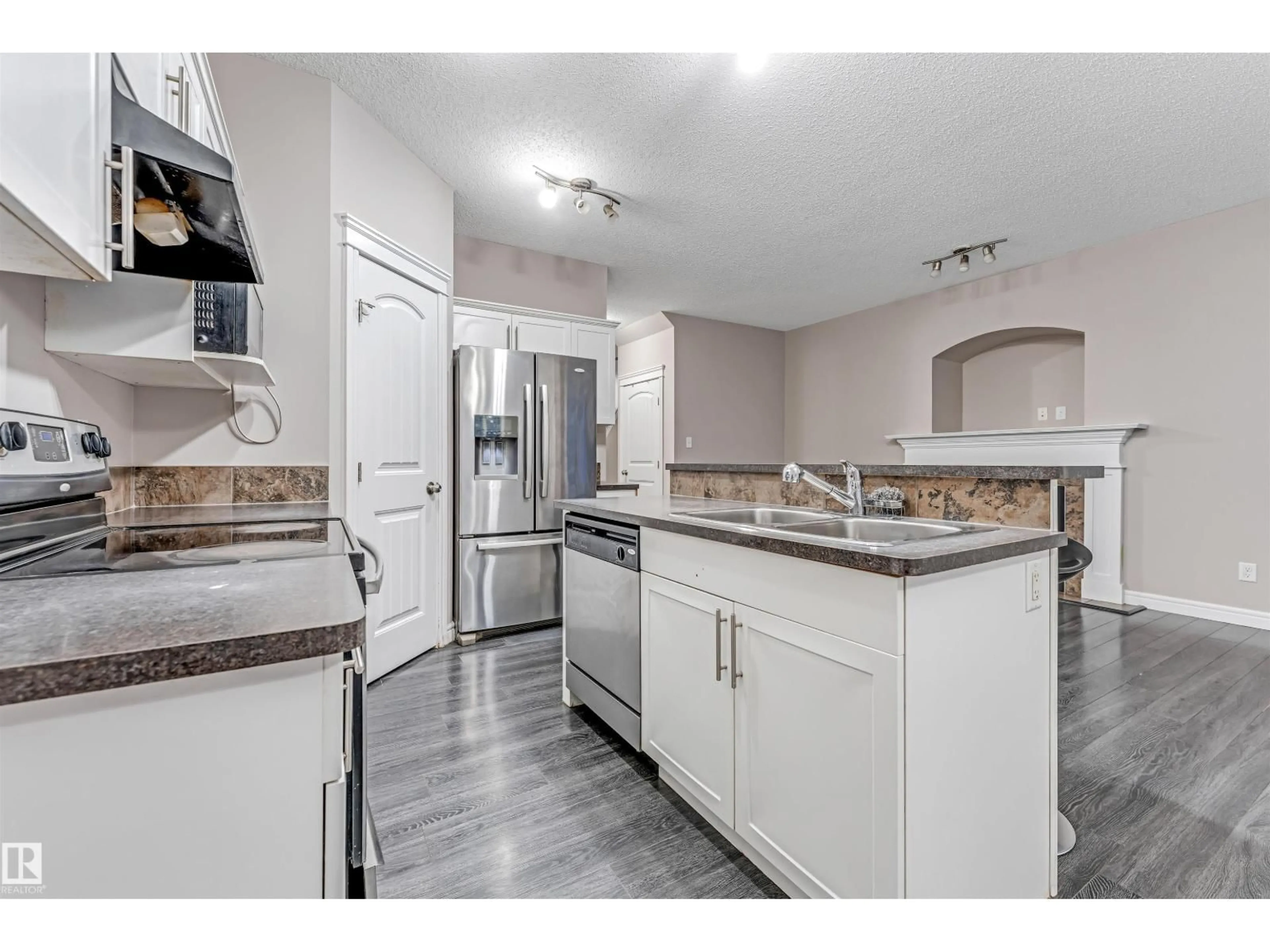 Open concept kitchen, ceramic/tile floor for 2929 16A AV, Edmonton Alberta T6T0P8