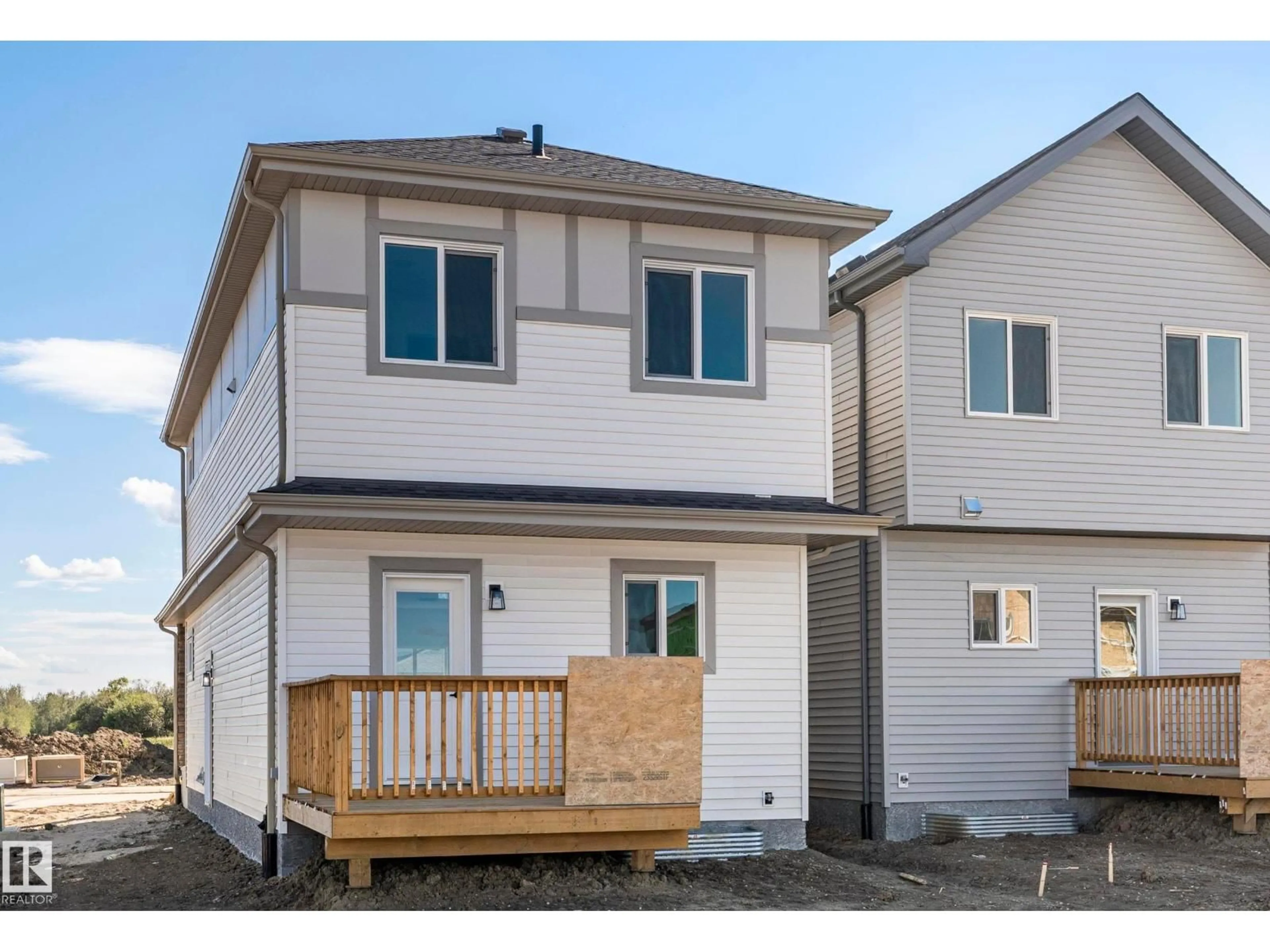Home with vinyl exterior material, street for 20818 15A AV, Edmonton Alberta T6M1K7