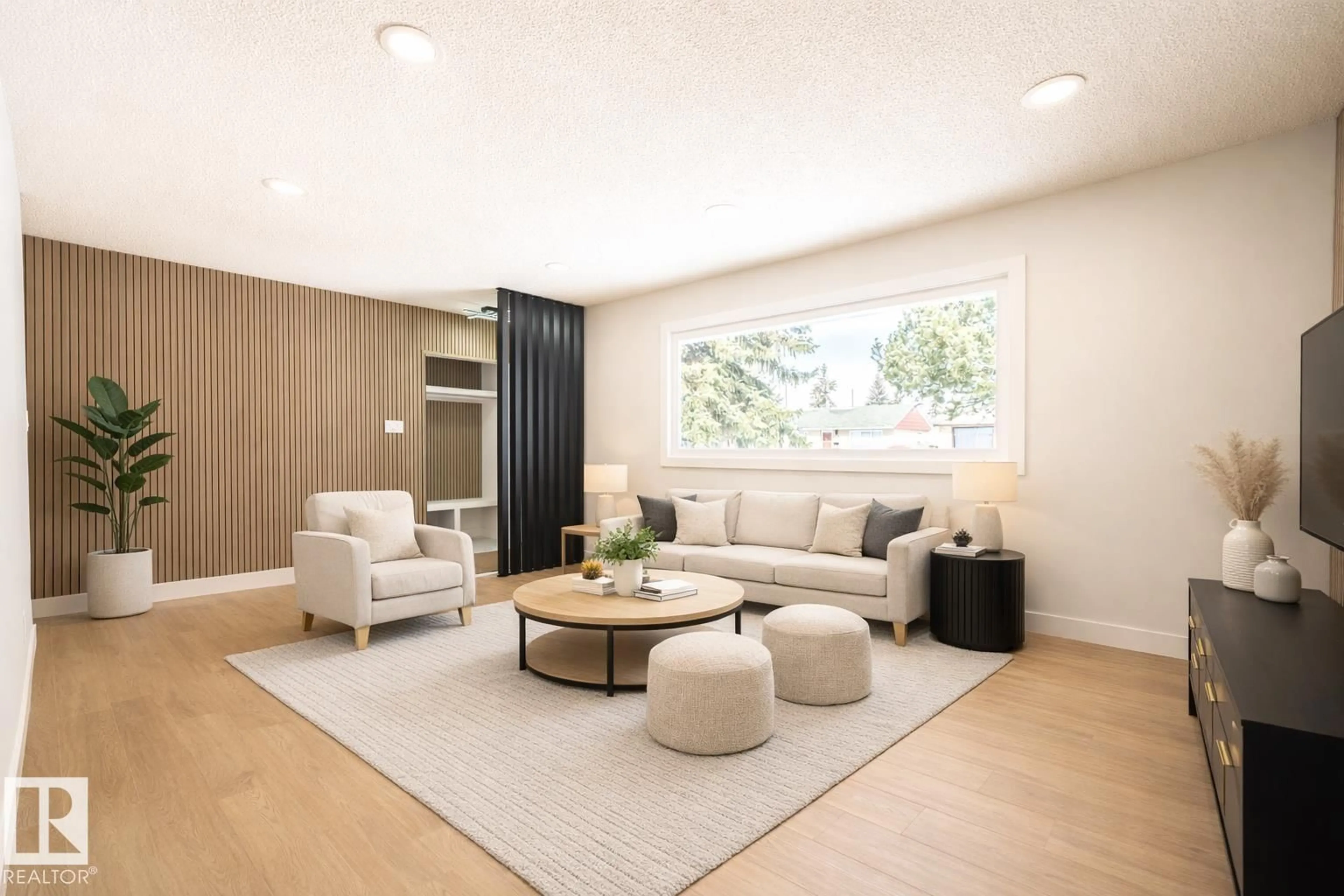 Living room with furniture, wood/laminate floor for 16131 109A AV, Edmonton Alberta T5P1C5