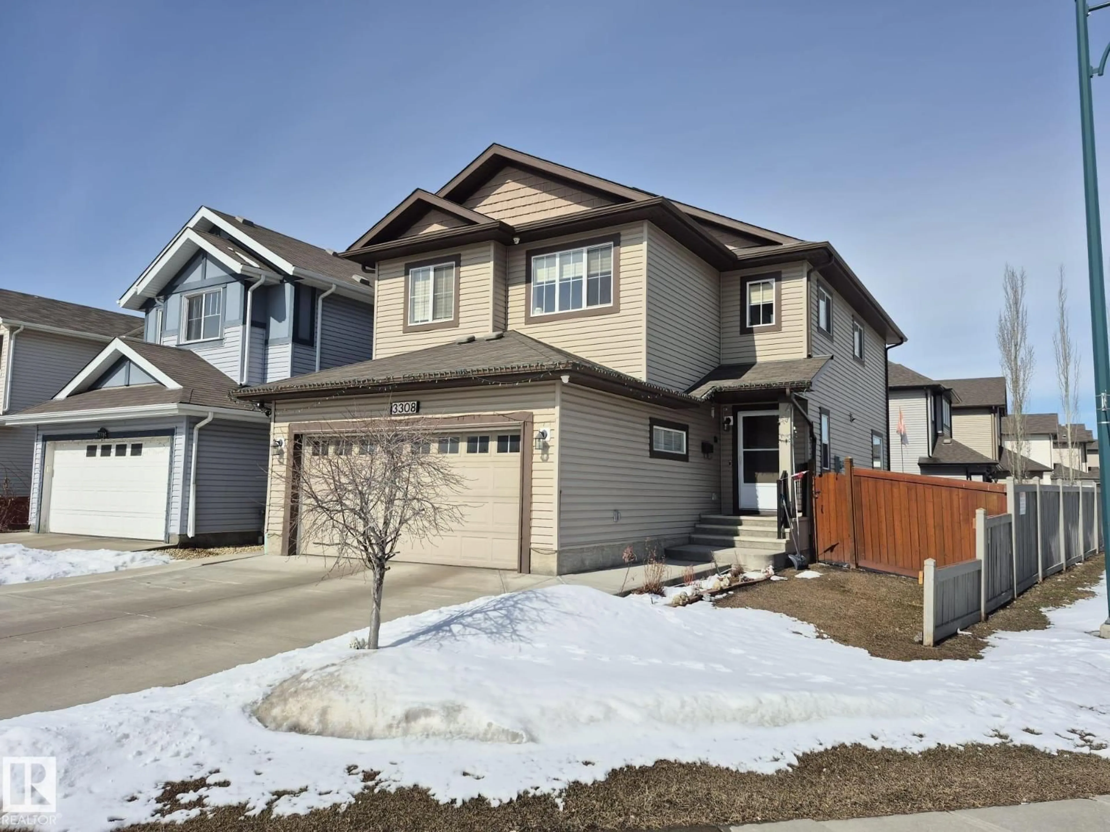 Home with vinyl exterior material, street for NW - 3308 18B AV, Edmonton Alberta T6T0R4
