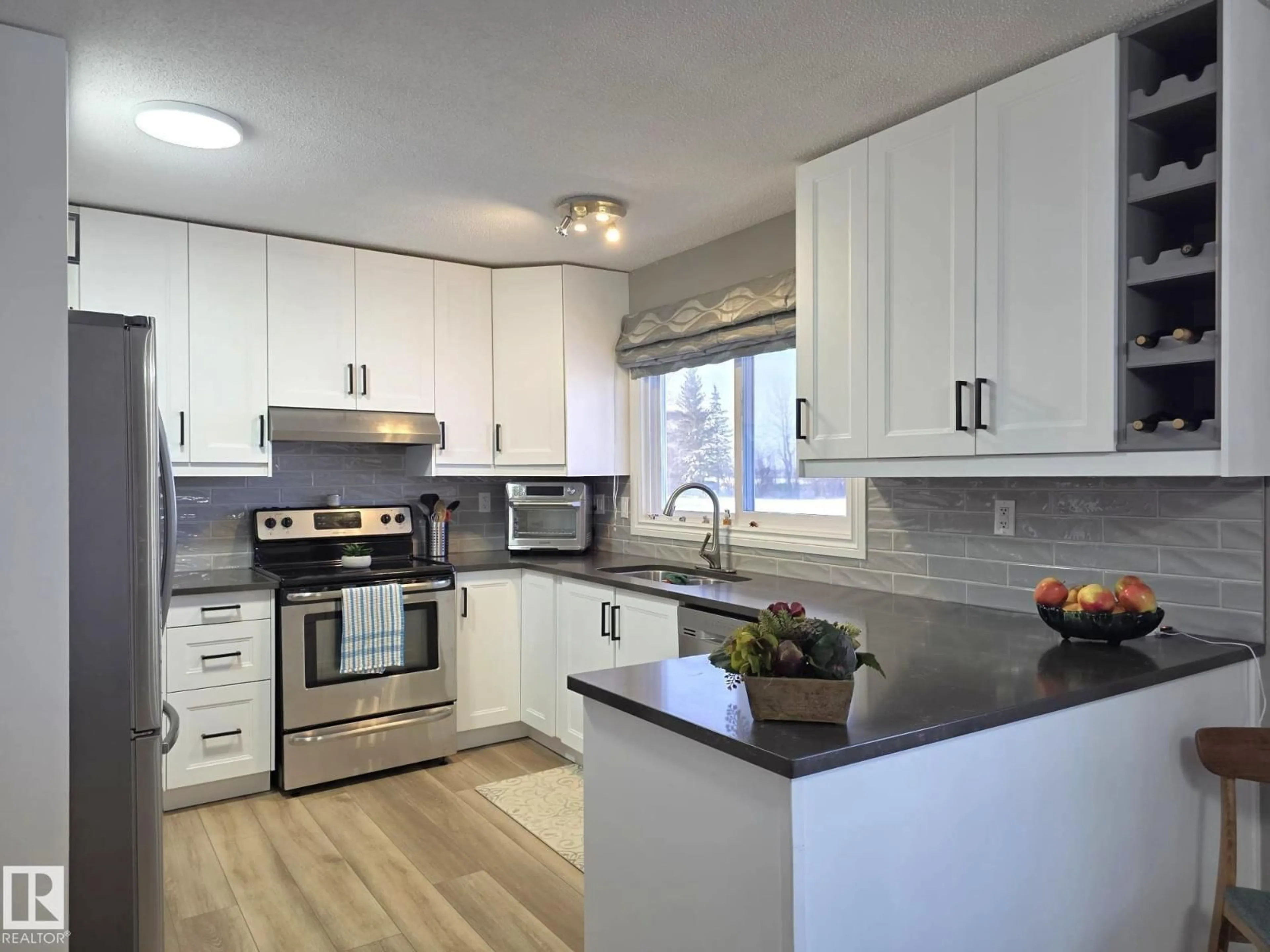 Open concept kitchen, wood/laminate floor for 4307 47 ST, Drayton Valley Alberta T7A1G8