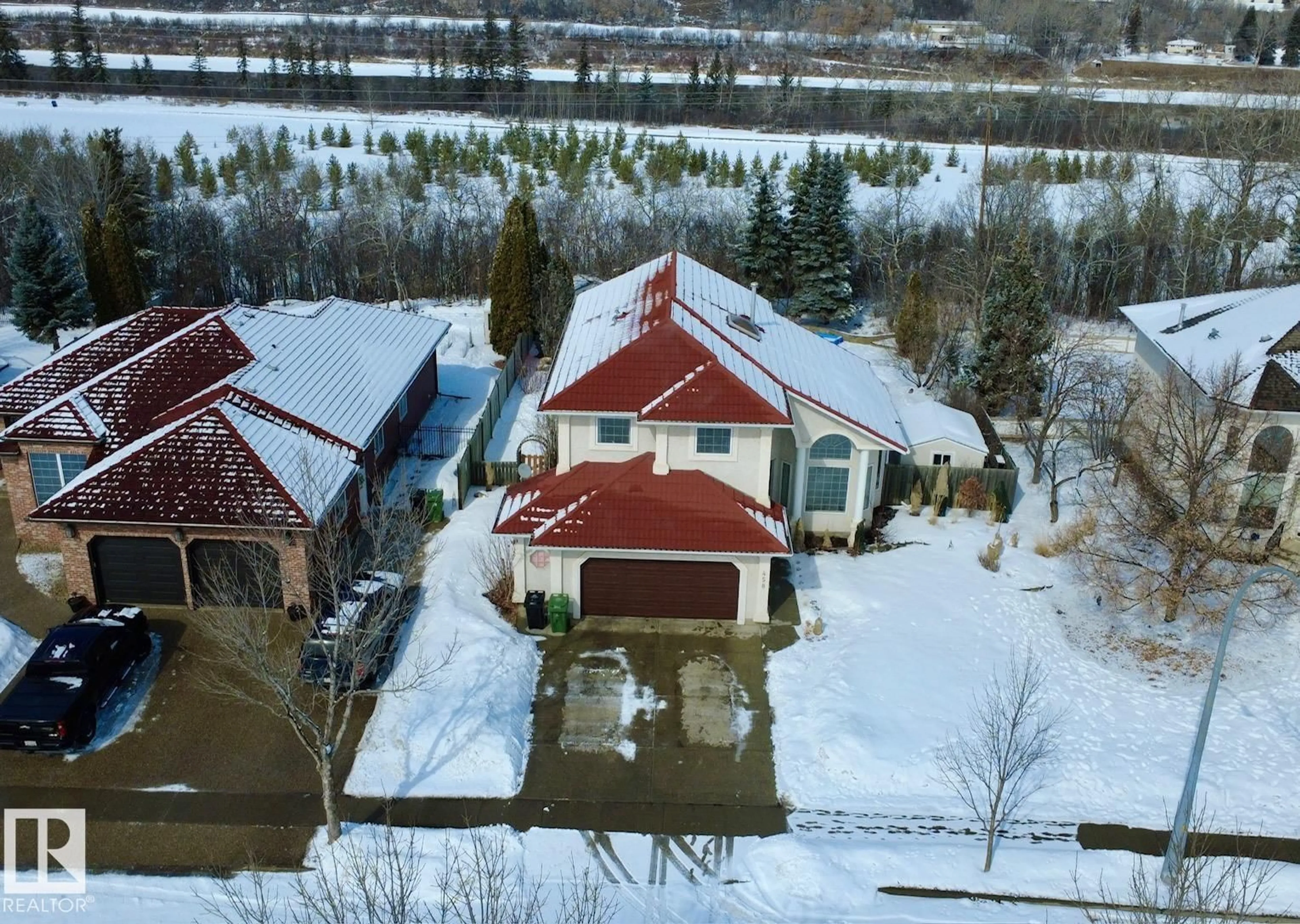 A pic from outside/outdoor area/front of a property/back of a property/a pic from drone, water/lake/river/ocean view for 458 RIVERPARK DR, Fort Saskatchewan Alberta T8L3X3