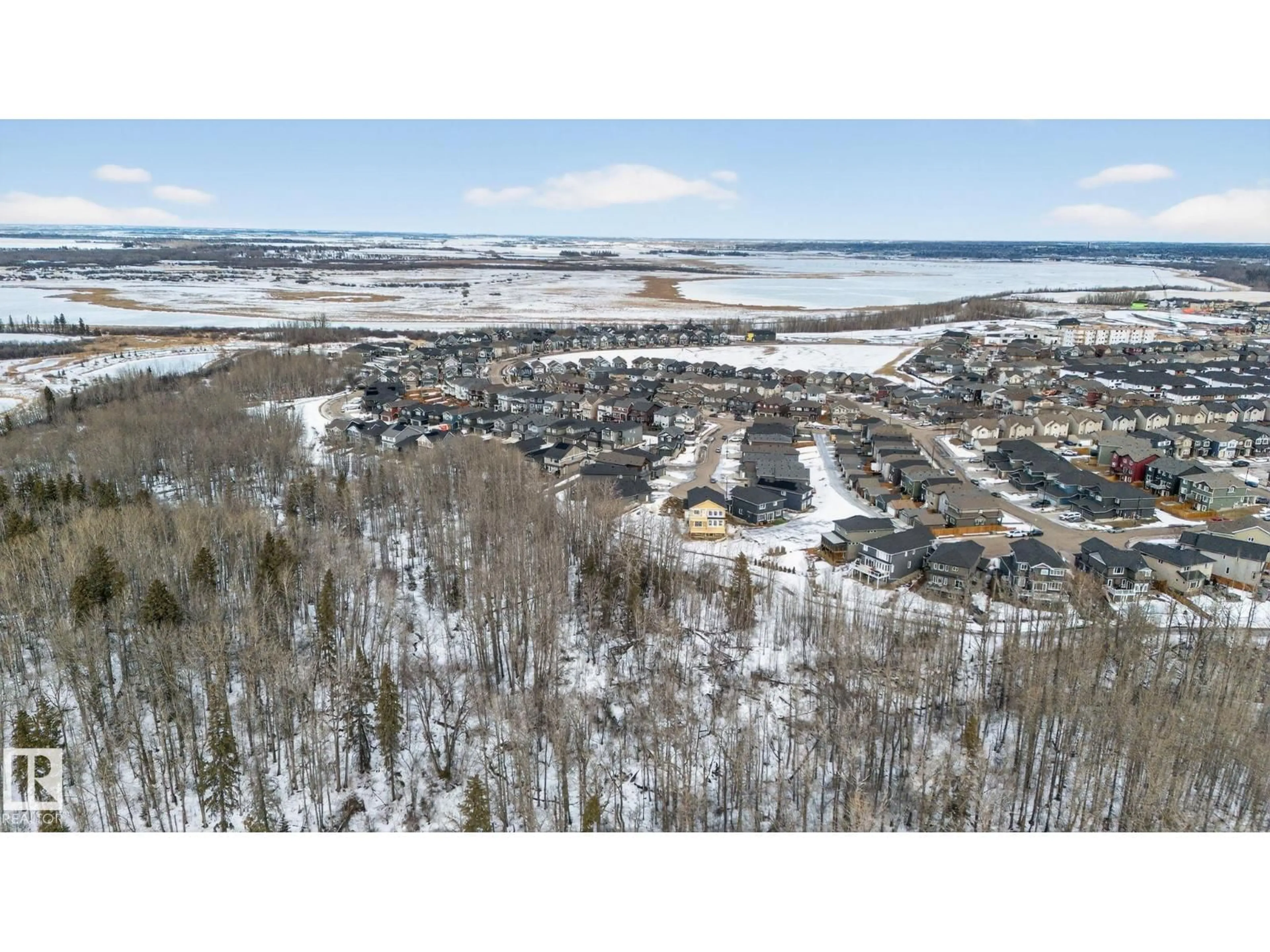 A pic from outside/outdoor area/front of a property/back of a property/a pic from drone, water/lake/river/ocean view for 1129 GYRFALCON CR, Edmonton Alberta T5S0S5