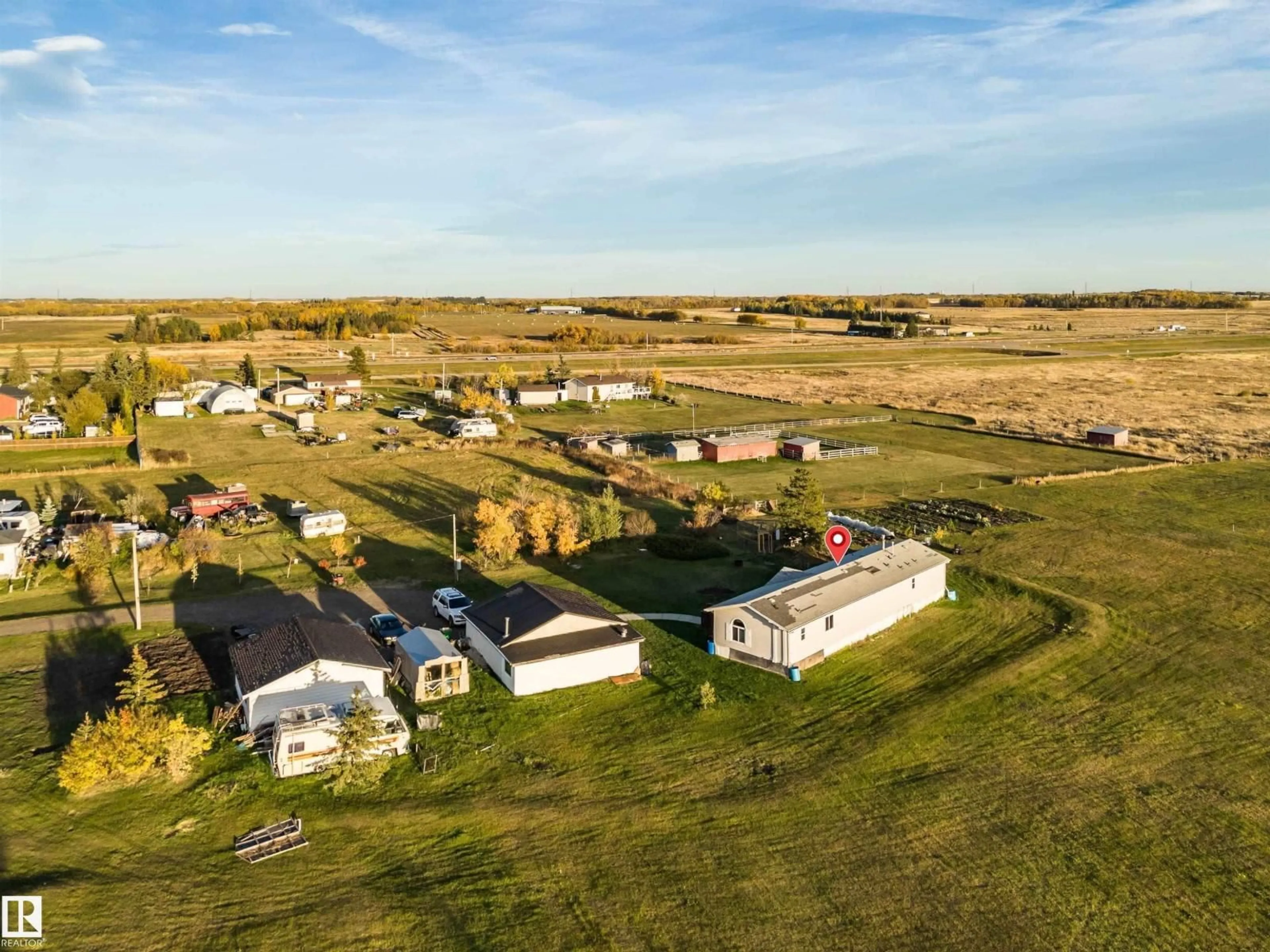 A pic from outside/outdoor area/front of a property/back of a property/a pic from drone, unknown for 1050 HWY 2, Rural Leduc County Alberta T4X2S4