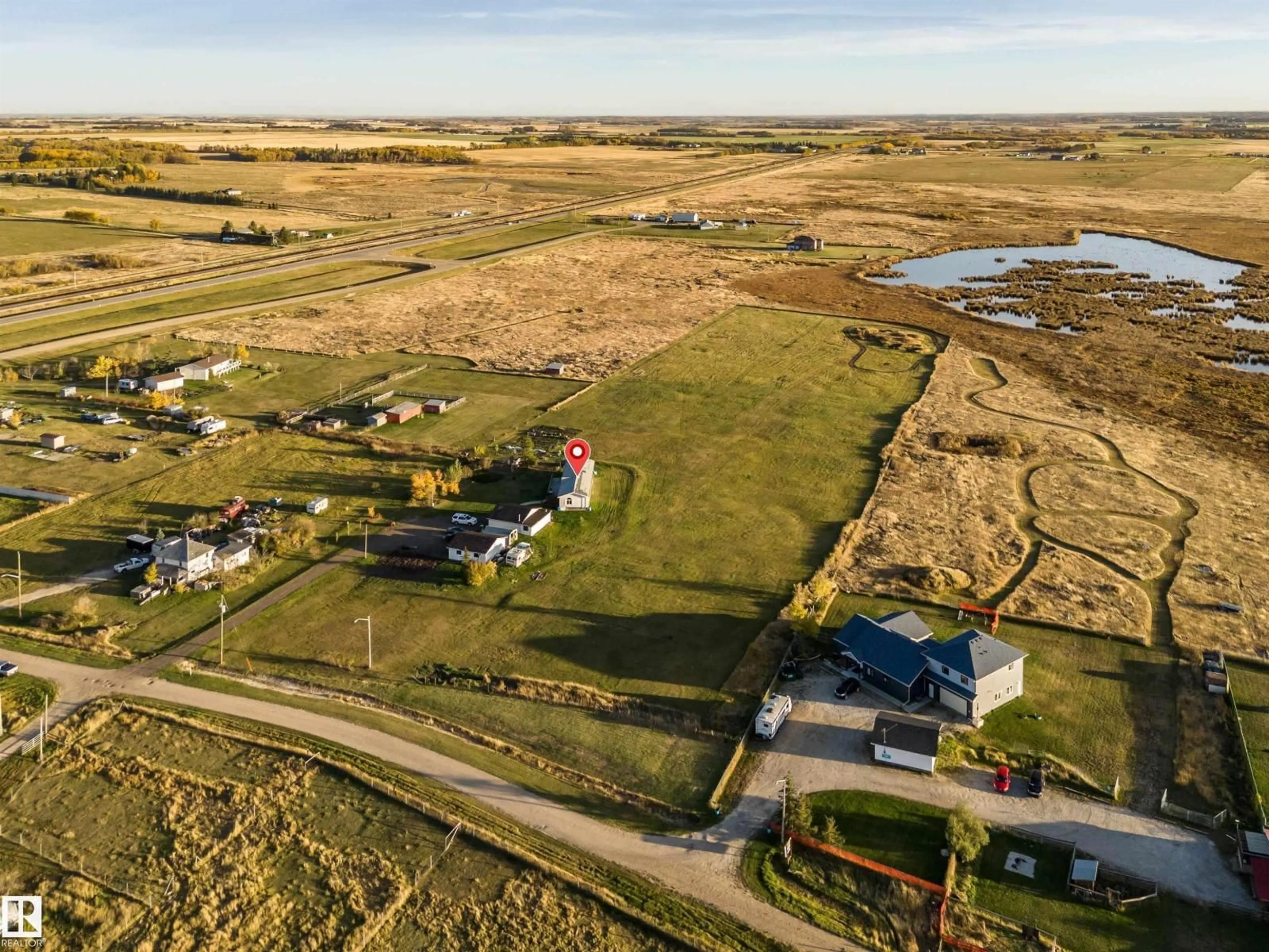 A pic from outside/outdoor area/front of a property/back of a property/a pic from drone, street for 1050 HWY 2, Rural Leduc County Alberta T4X2S4