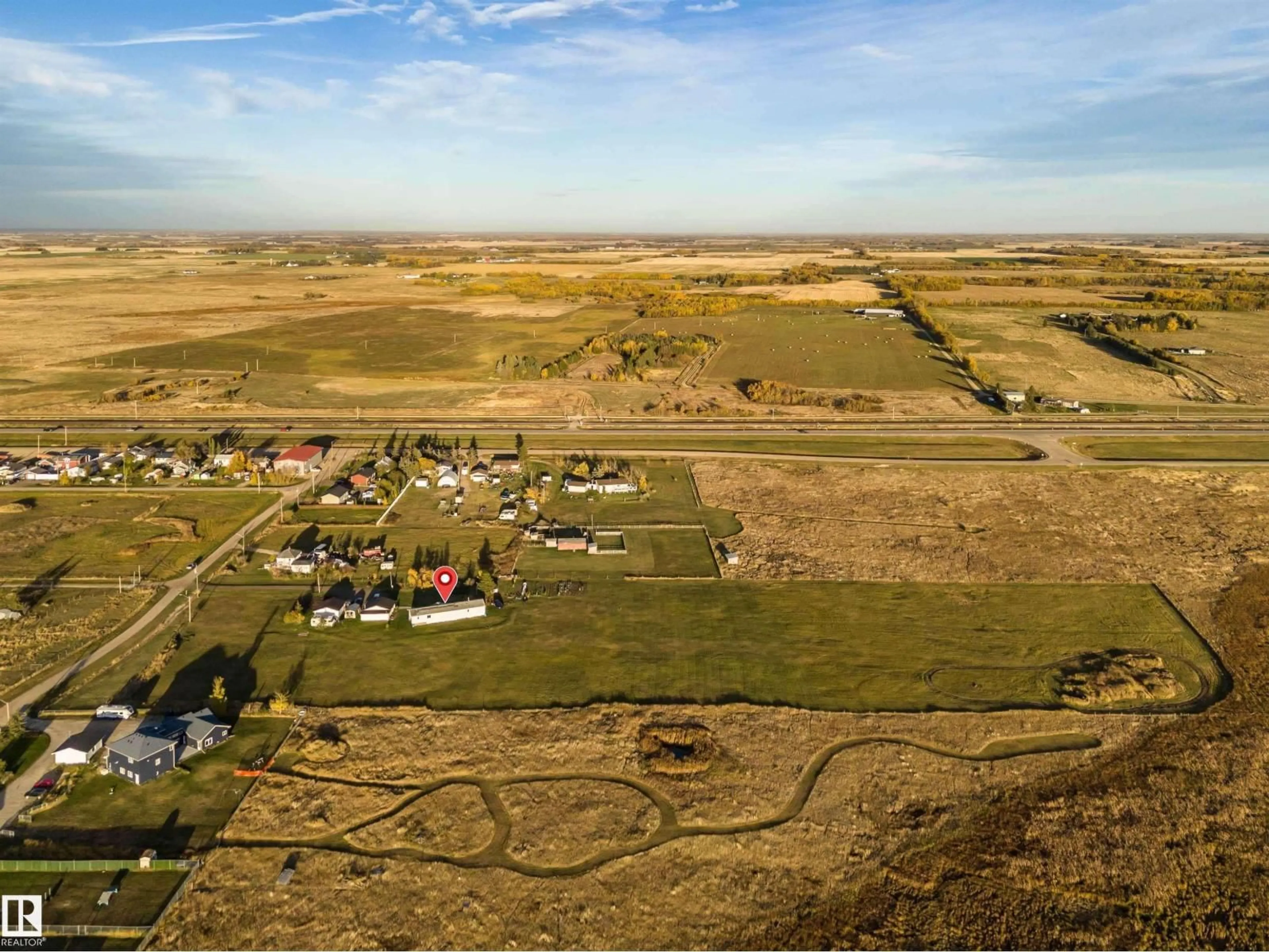 A pic from outside/outdoor area/front of a property/back of a property/a pic from drone, street for 1050 HWY 2, Rural Leduc County Alberta T4X2S4